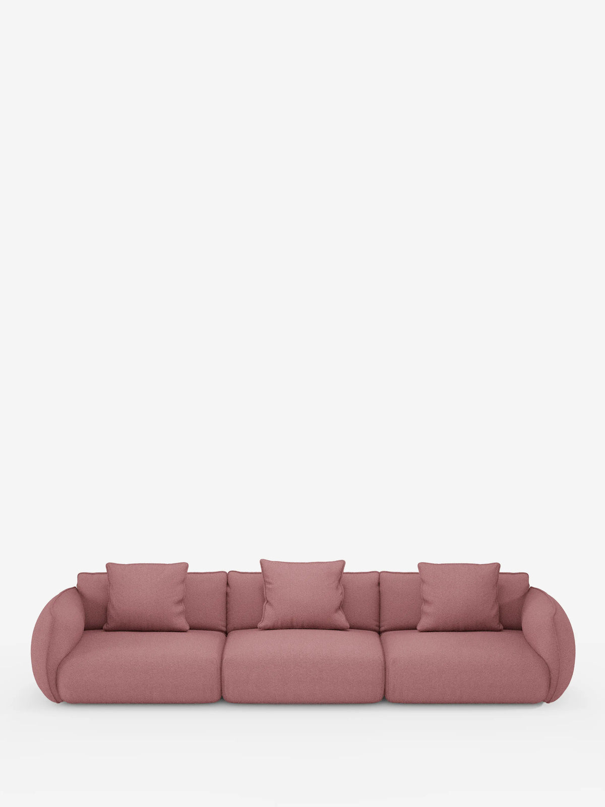 Un divano modulare contemporaneo Nimbus a 3 posti, componibile, realizzato in morbido tessuto smacchiabile effetto cotone T33 di Divani.Store, rivestito in un delicato tessuto rosa tenue, caratterizzato da braccioli e schienali leggermente arrotondati. Posizionato su uno sfondo bianco a tinta unita, questo divano elegante e facilmente smontabile comprende tre cuscini di seduta e cinque cuscini decorativi abbinati, disposti ordinatamente sulla superficie.