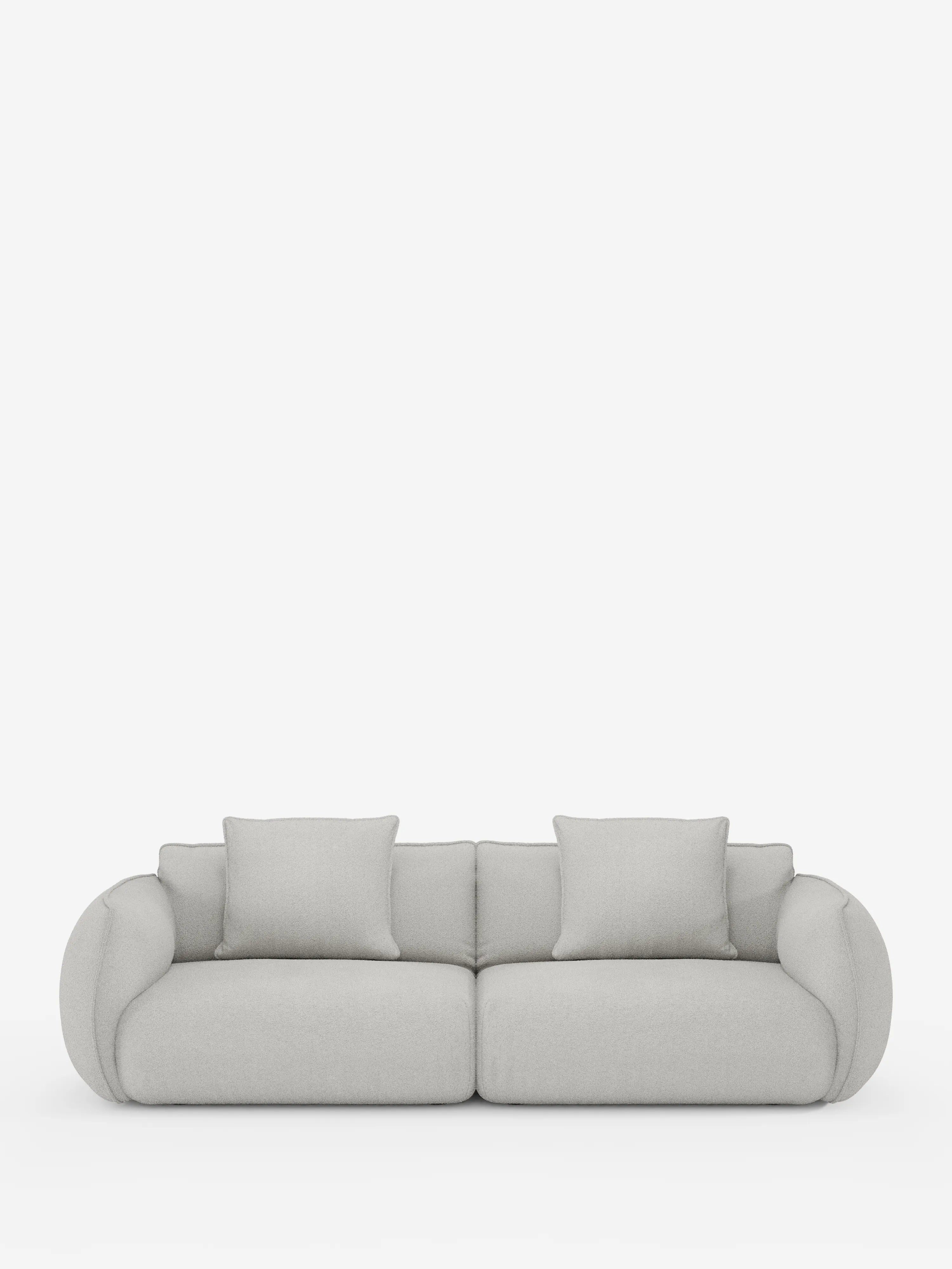 Il divano Nimbus, un modello contemporaneo a 3 posti, modulare e componibile da 250 cm di Divani.Store, è presentato su uno sfondo bianco a tinta unita. Rivestito in tessuto grigio chiaro effetto cotone antimacchia (t33), questo divano presenta braccioli e schienale lisci e arrotondati, due generosi cuscini di seduta e due cuscini quadrati abbinati per lo schienale. Il suo design minimalista esalta sia lo stile che il comfort, con fodere completamente sfoderabili per una facile manutenzione.