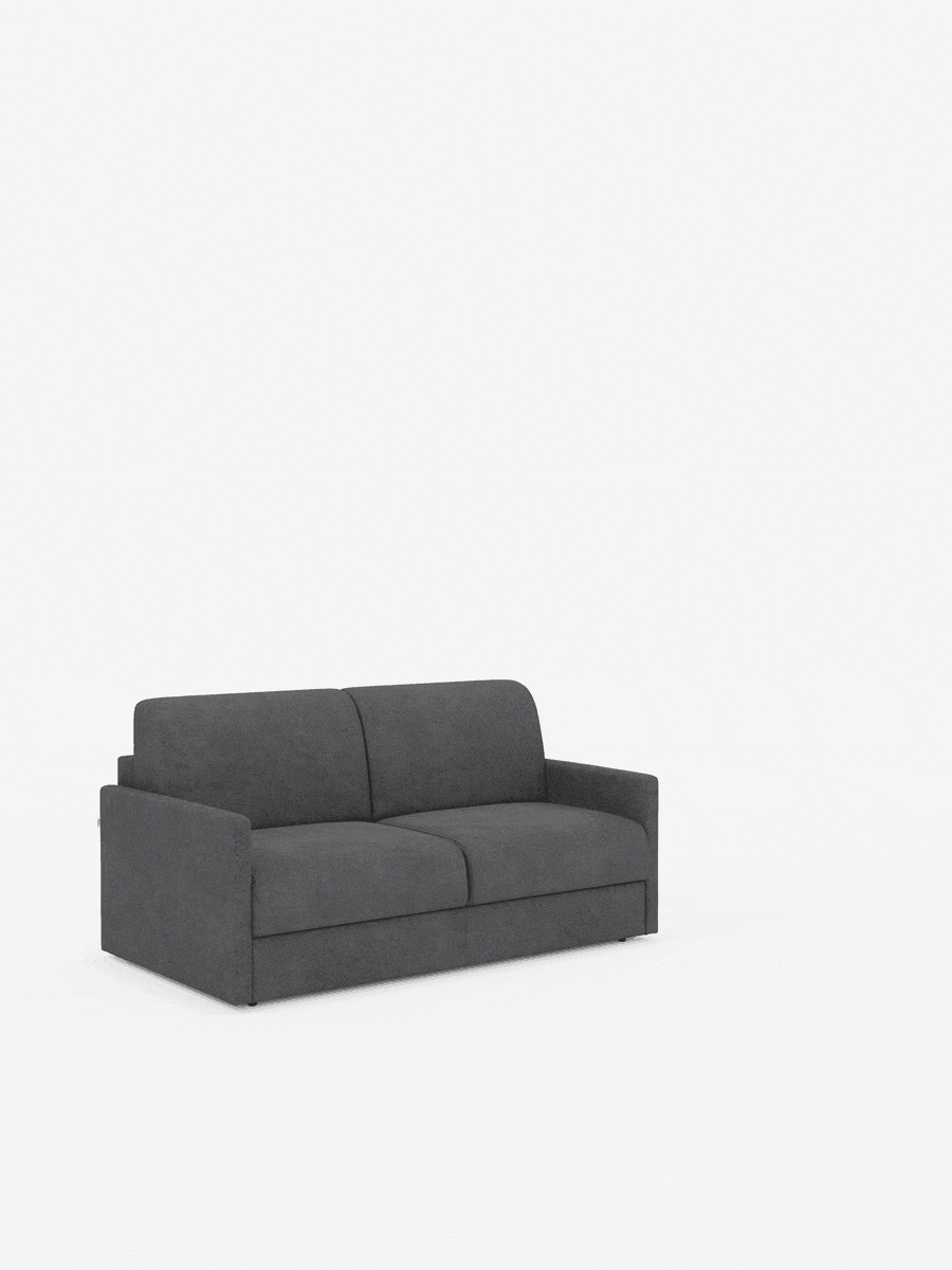 Un divano letto Tommy Divano a 2 e 3 posti matrimoniale, in grigio scuro e dal design moderno, di Divani.Store, è posizionato al centro su uno sfondo bianco. Caratterizzato da linee rette e braccioli bassi, questo divano compatto è rivestito in tessuto T33, morbido, lussuoso, sfoderabile e resistente alle macchie, che ricorda il cotone. Non sono presenti decorazioni aggiuntive, cuscini né gambe visibili sotto il divano.