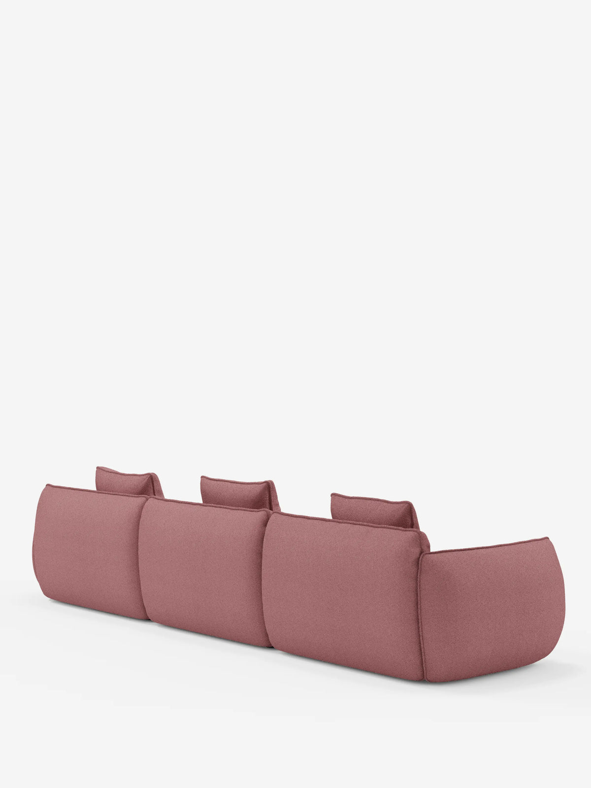 Il divano angolare con penisola componibile Nimbus di Divani.Store è un divano rosa moderno e minimalista a tre posti con tre cuscini dello schienale, ripreso di retro su uno sfondo bianco a tinta unita. Rivestito in morbido tessuto T33 effetto cotone resistente alle macchie, questo elegante modello presenta bordi delicatamente arrotondati e gambe non visibili, per un look basso e confortevole.