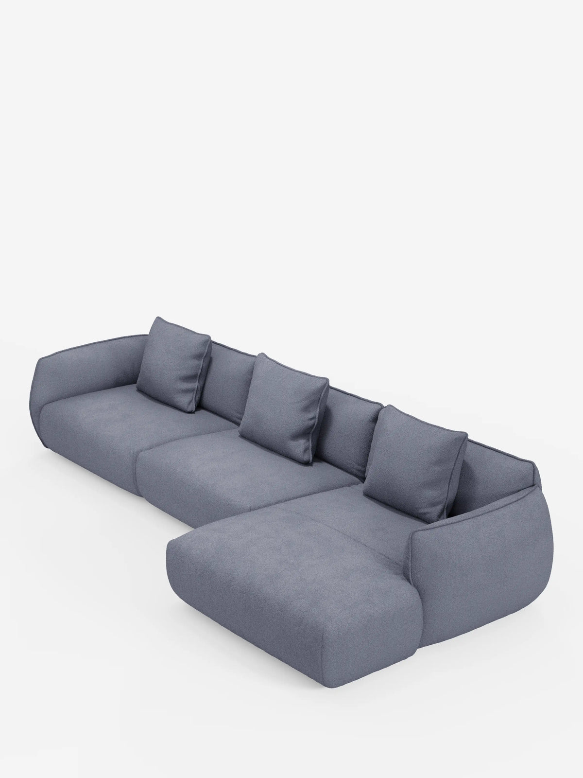 Un divano angolare con penisola componibile Nimbus, moderno e spazioso, di Divani.Store, rivestito in tessuto T33 effetto cotone grigio medio, smacchiabile, con quattro cuscini dello schienale sfoderabili e un’ampia chaise longue sul lato destro. Questo divano moderno presenta linee arrotondate e minimaliste e braccioli dal profilo basso, che risaltano su uno sfondo bianco a tinta unita.