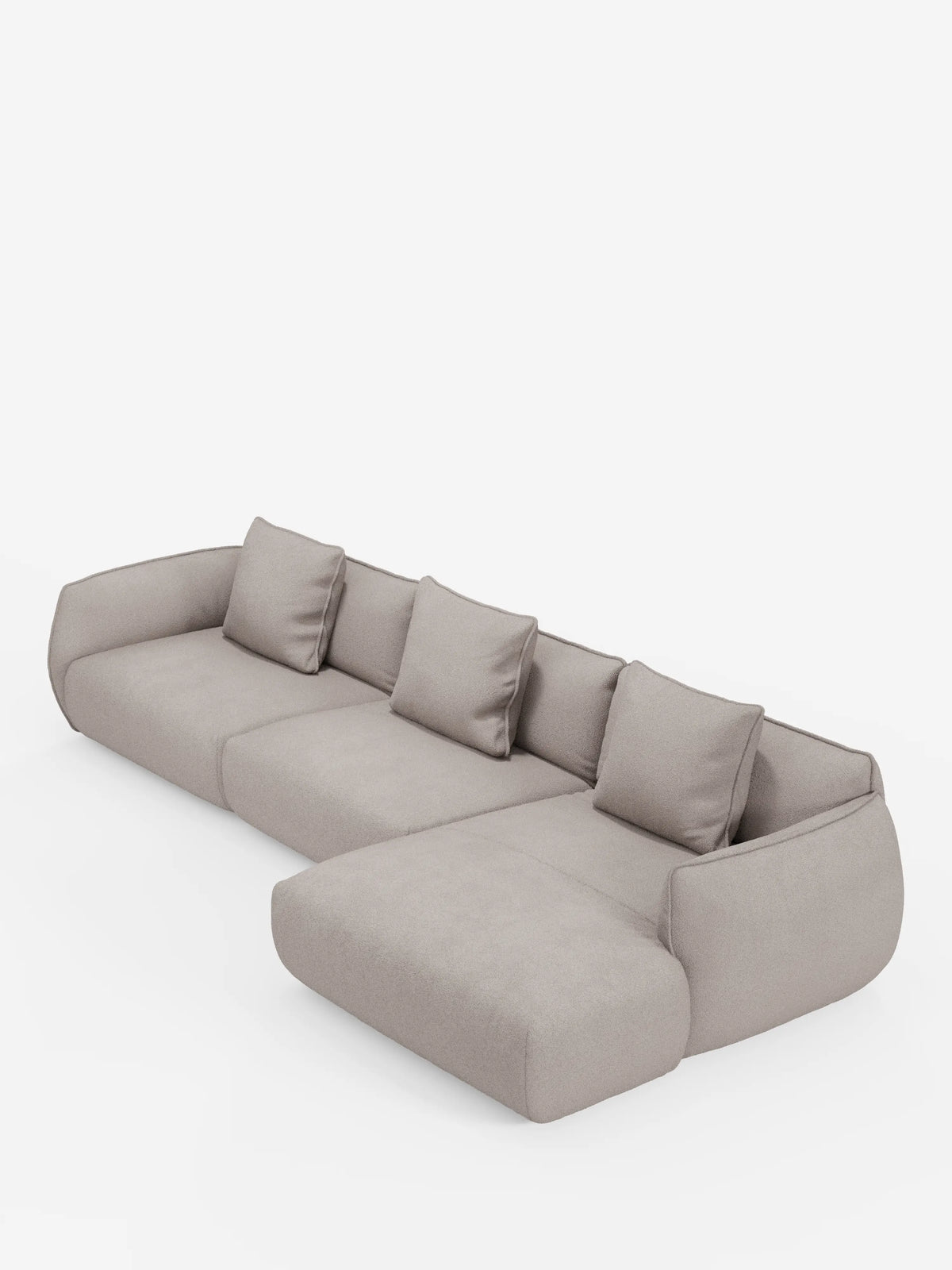 Il divano angolare con penisola componibile Nimbus in morbido tessuto effetto cotone smacchiabile T33 di Divani.Store è un divano componibile moderno, di colore grigio chiaro, dotato di quattro cuscini di seduta e quattro cuscini dello schienale abbinati. Questo divano ad angolo è caratterizzato da bordi arrotondati e da una chaise longue allungata sul lato destro, che risalta magnificamente su uno sfondo bianco a tinta unita.