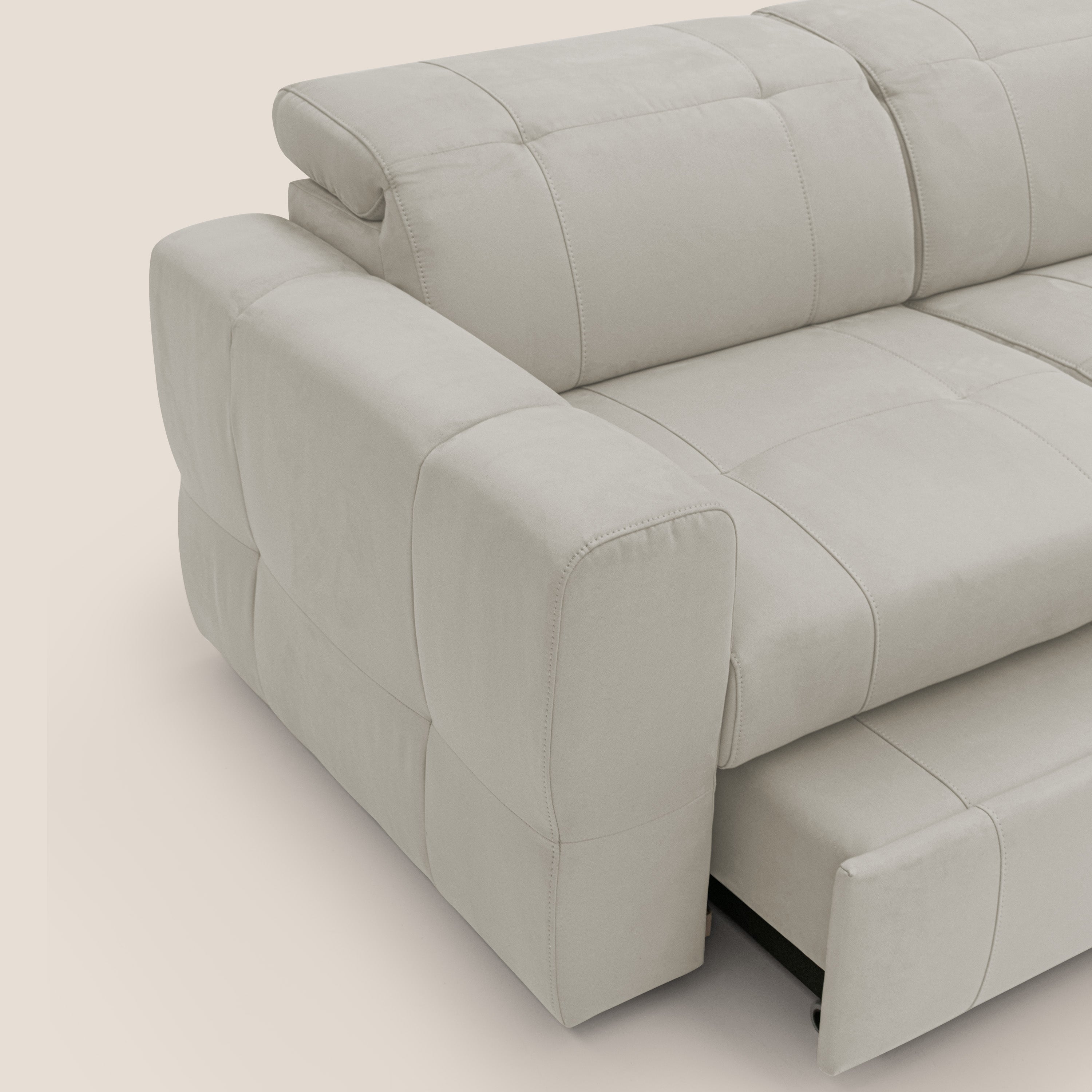 Kronos Divano angolare con poggiapiedi estraibile e pouf contenitore mobile in microfibra impermeabile T11 panna - divani.store