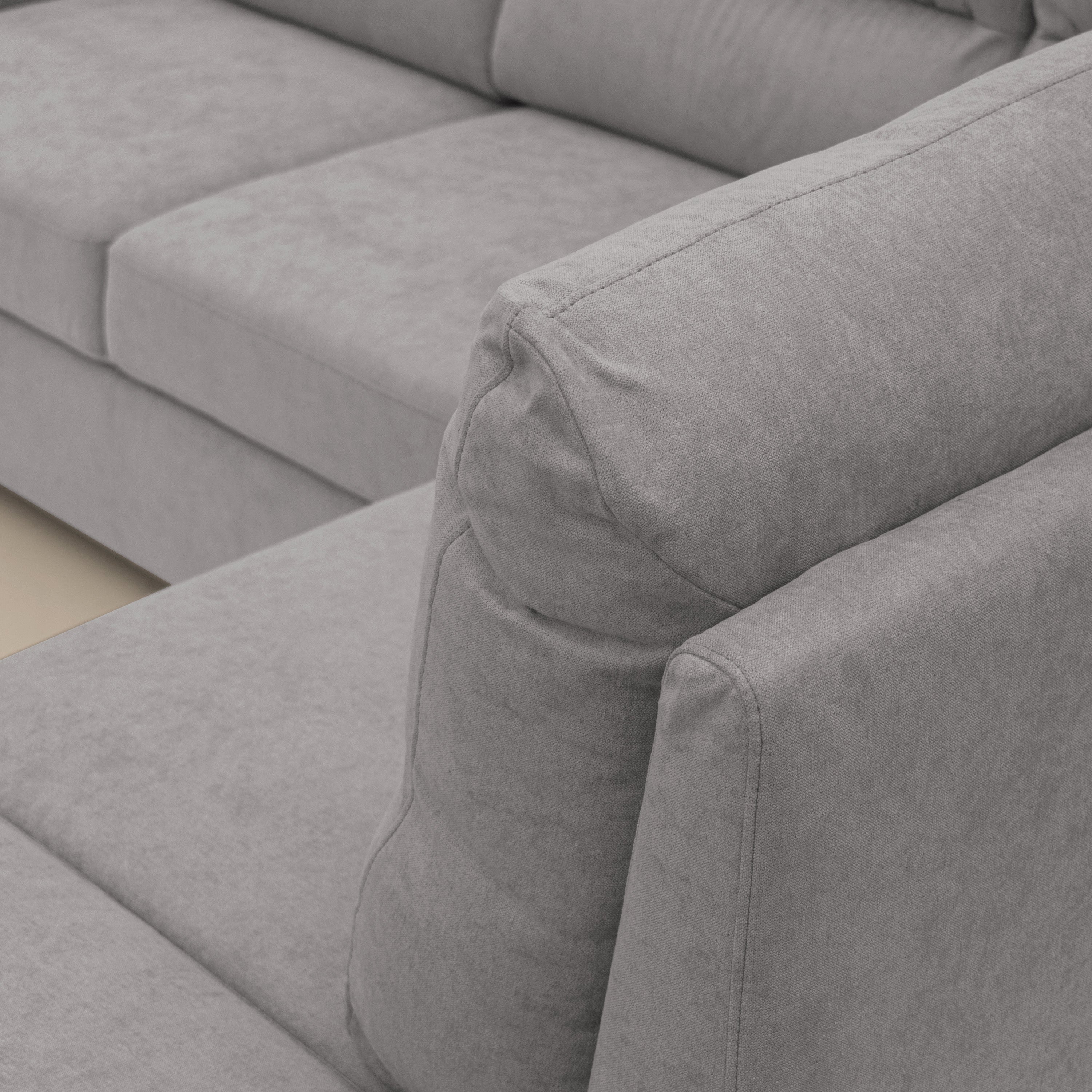 Minerva divano angolare con estraibile a cassettone e pouf contenitore in tessuto morbido impermeabile T02 grigio chiaro - divani.store