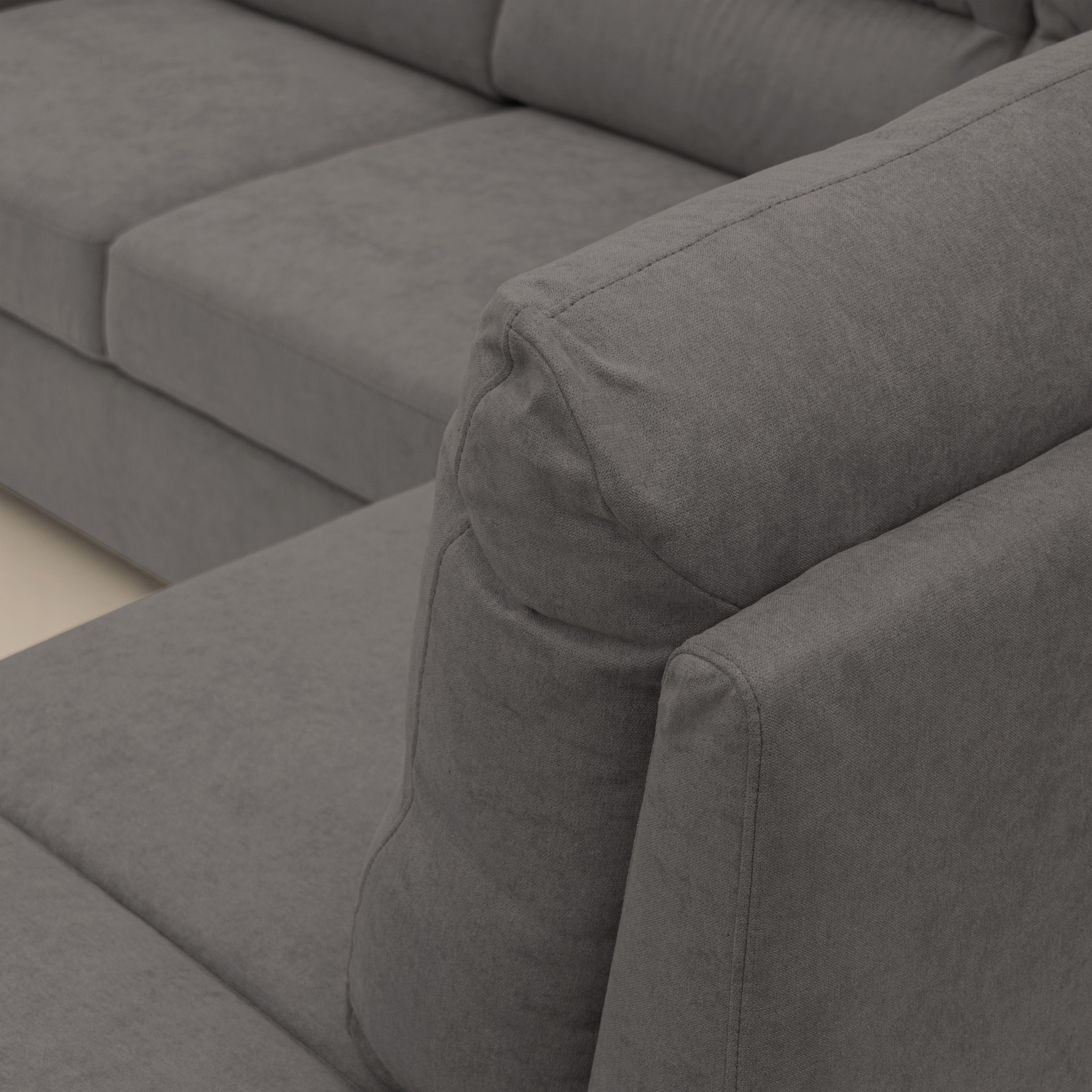 Minerva divano angolare con estraibile a cassettone e pouf contenitore in tessuto morbido impermeabile T02 grigio - divani.store