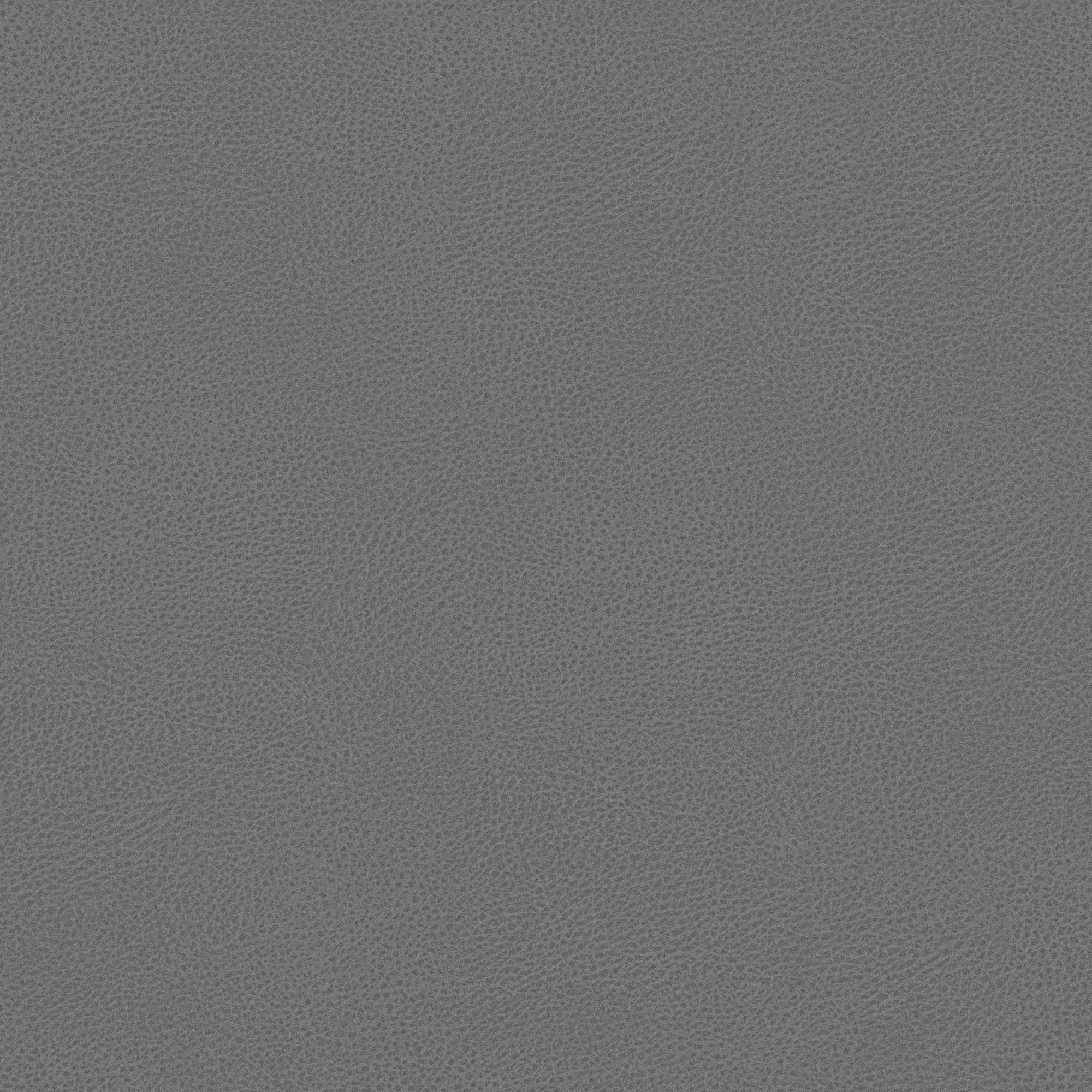 Primo piano della microfibra grigia, effetto pelle e antimacchia, del letto contenitore Nina di Letti.store, dal design minimale e dall'elegante motivo a ciottoli.