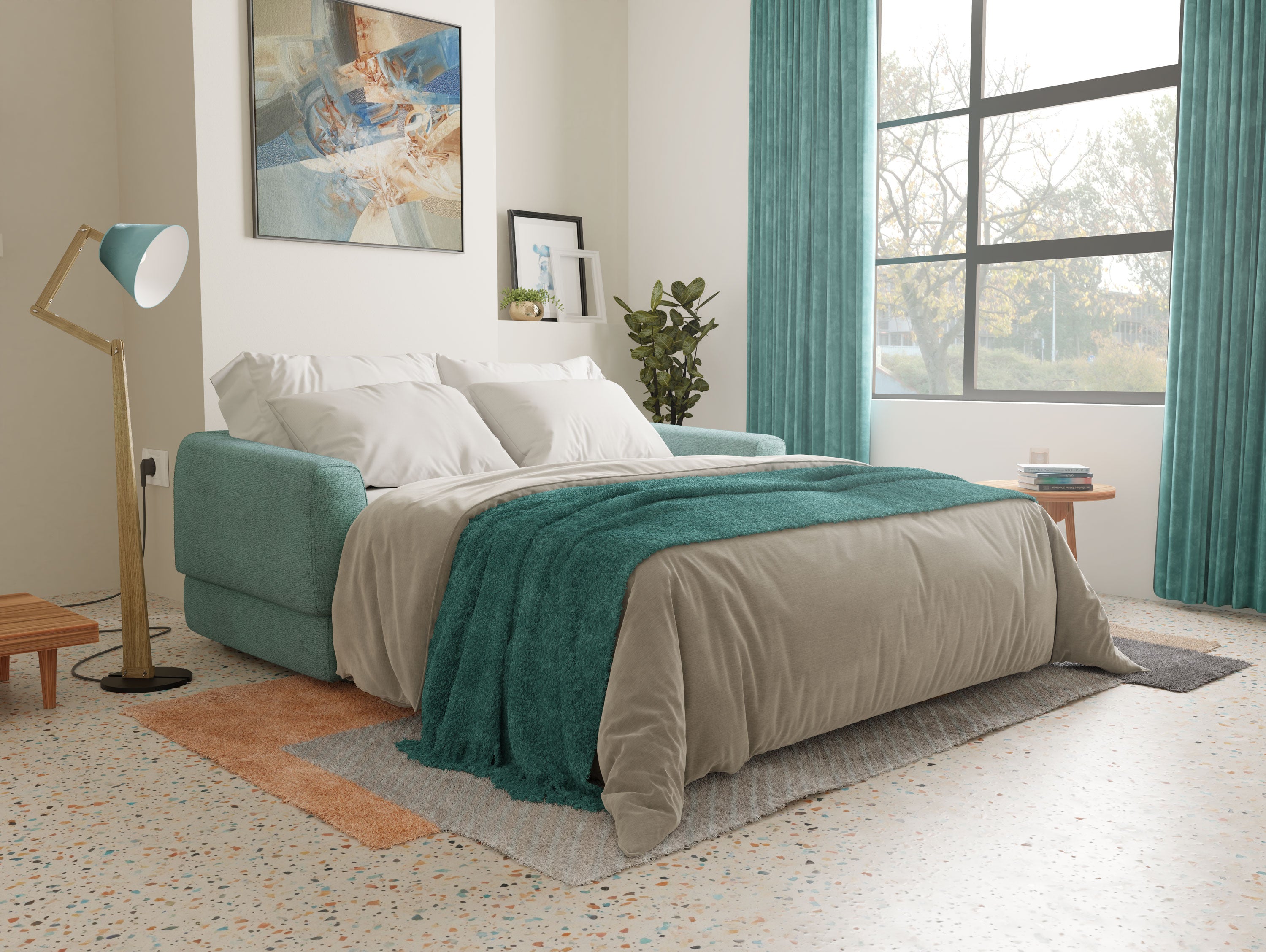 Un'accogliente camera da letto con il letto matrimoniale Happy Divano di Divani.Store in tessuto impermeabile salvia, biancheria da letto grigia e verde acqua, una lampada da terra moderna color oro, opere d'arte a parete, una pianta in vaso, pavimenti in terrazzo con tappeti e un'ampia finestra con tende verde acqua per la luce naturale.