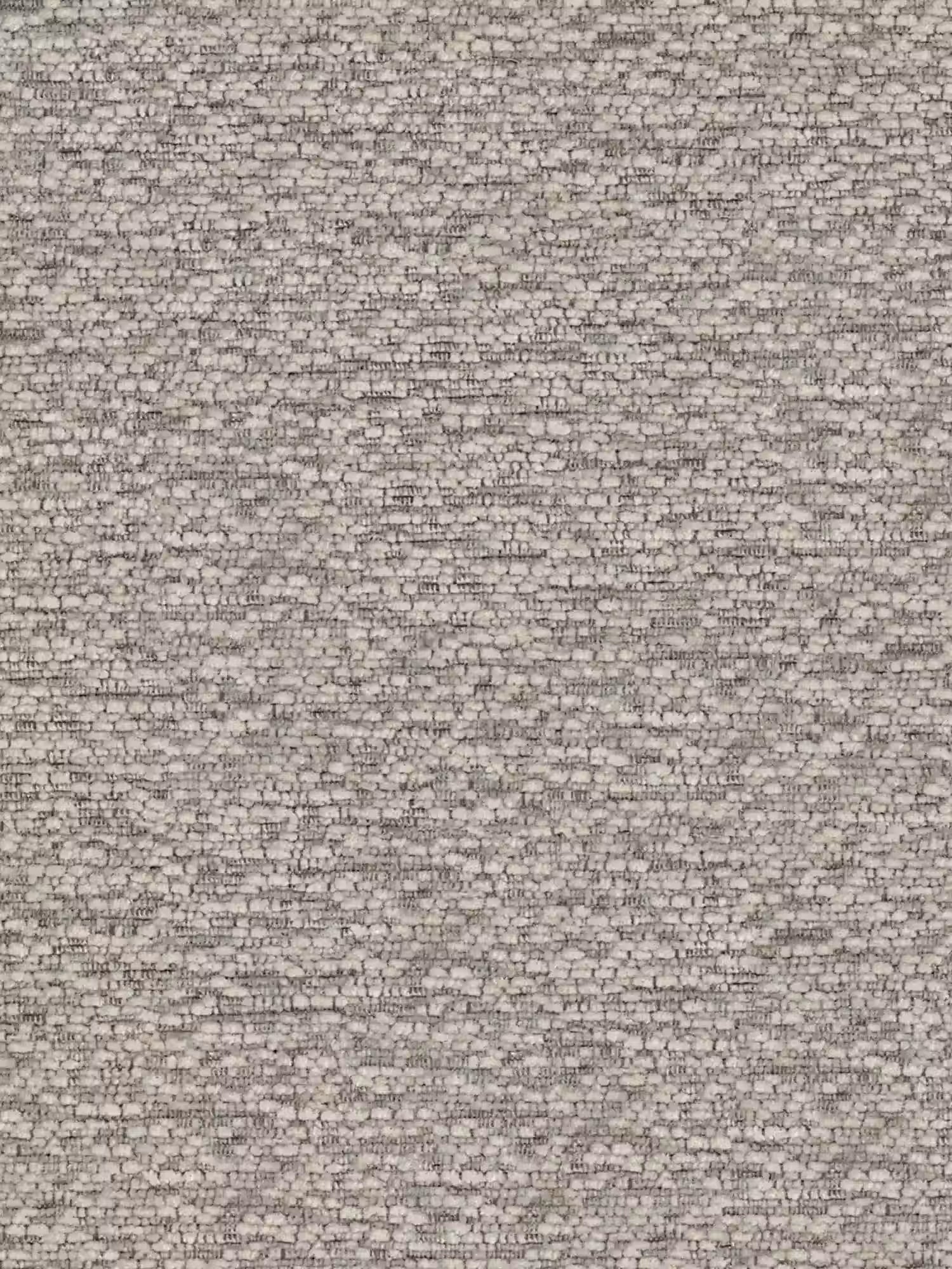 Un primo piano di un muro in mattoni di pietra nei toni del grigio chiaro e del beige, con pietre disposte a scaglione e malta irregolare, crea uno sfondo rustico, perfetto per mettere in risalto la sedia “Alba” imbottita in tessuto effetto cotone OEKO-TEX® di Divani.Store, con base in metallo nero.