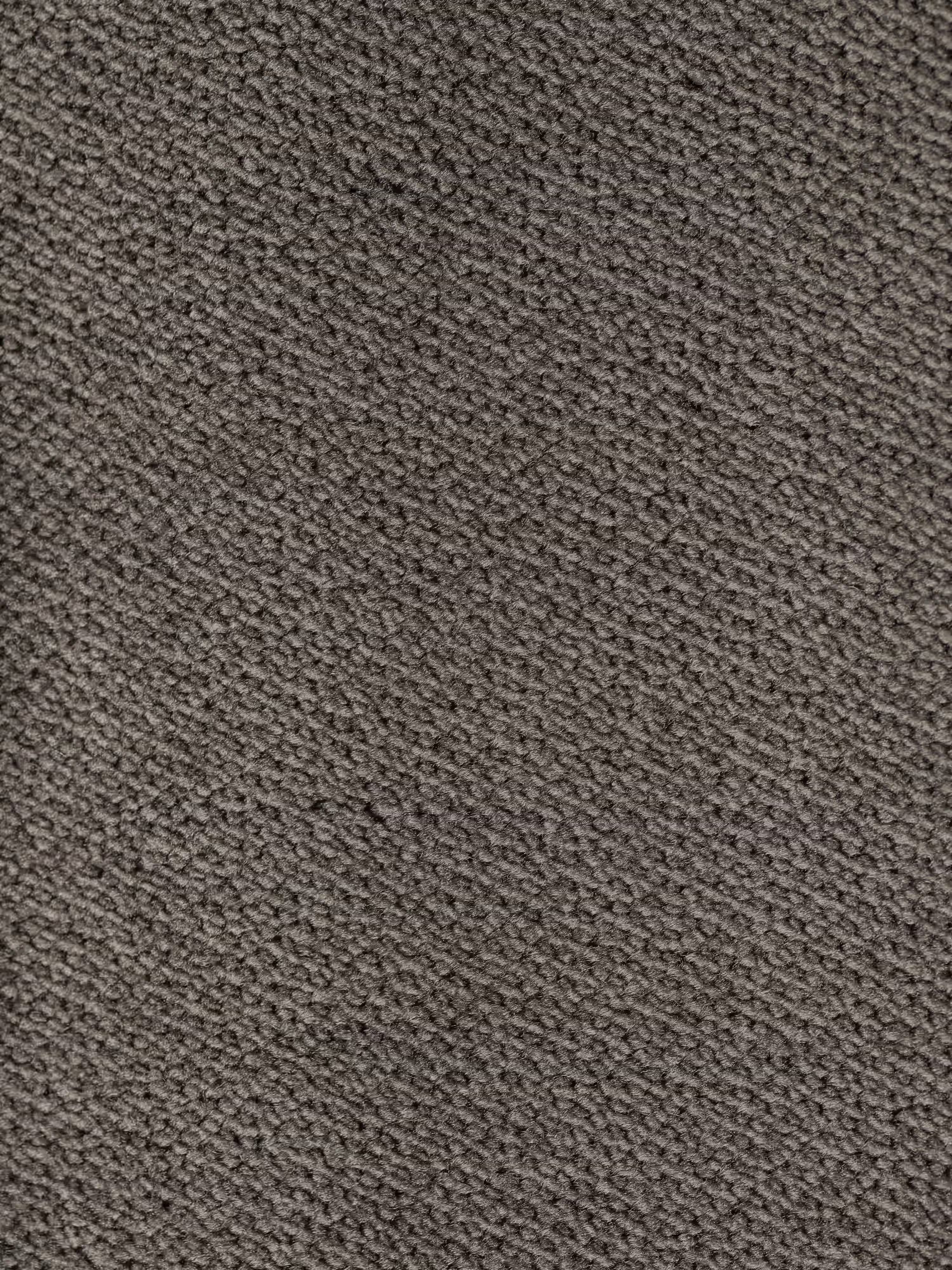 Un primo piano dell’elegante tessuto grigio scuro “vellutino smacchiabile T30” che riveste il divano Michelangelo 4 Posti di Divani.Store, un divano con tre sedute estensibili e poggiatesta reclinabili. Il tessuto presenta una trama diagonale piacevole al tatto, spessa, fitta e dall’aspetto uniforme. La superficie è impeccabilmente pulita, senza segni o macchie visibili.
