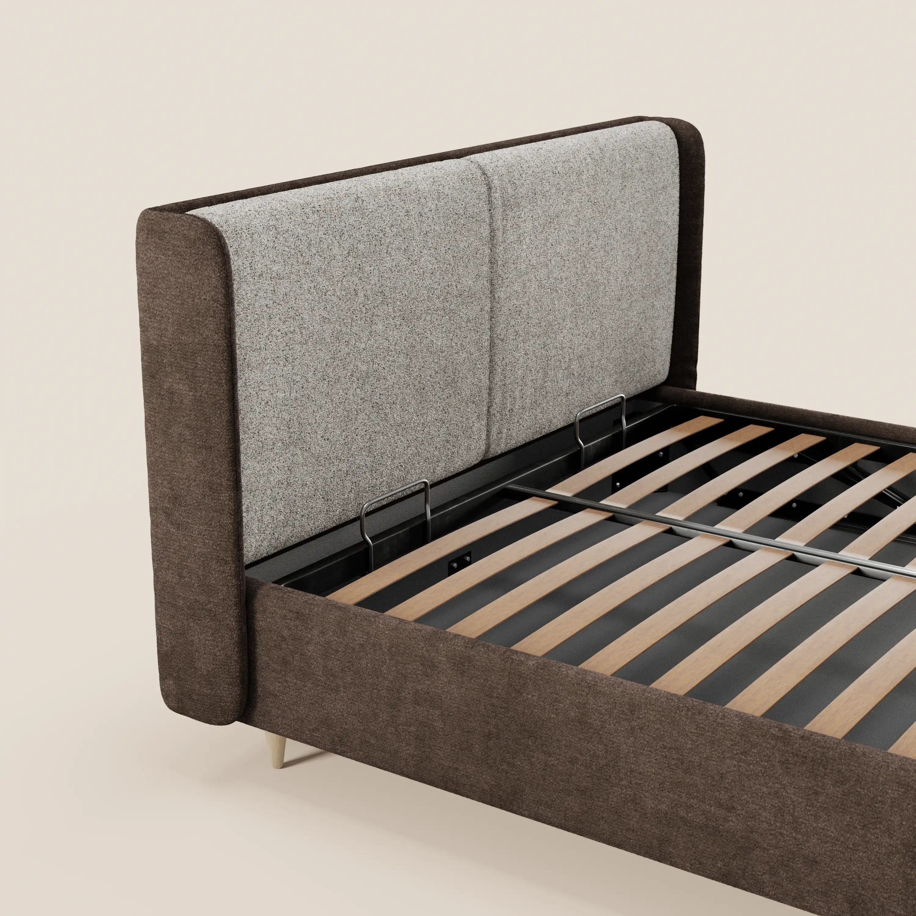 Il letto imbottito VALKIRIA di Letti.store presenta un design bicolore con un ampio vano contenitore, cuscini imbottiti per lo schienale e una testiera curva e avvolgente, come si vede nella foto su uno sfondo beige chiaro.