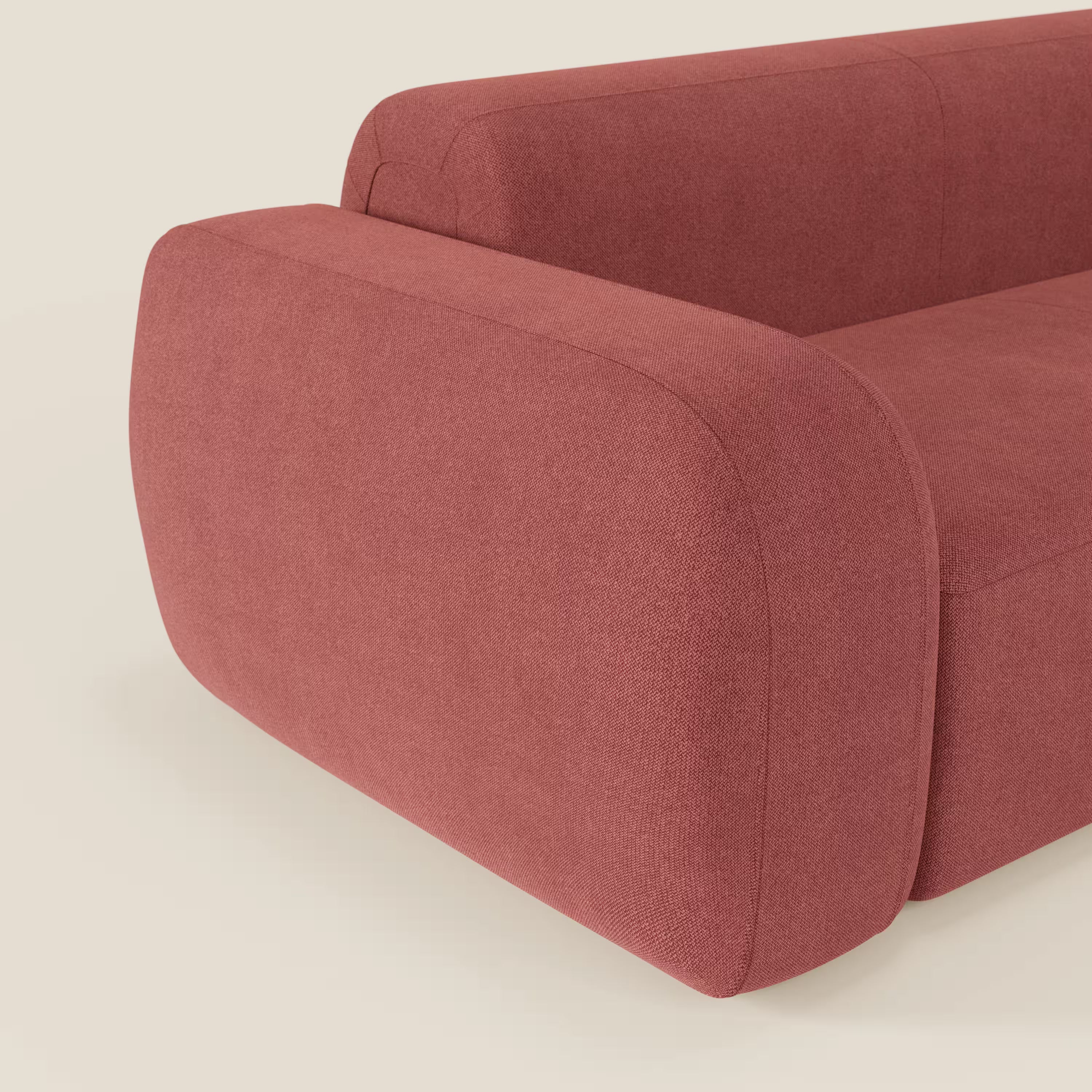 Il BonBon Divano modulare Lineare 220 di Divani.Store è un divano contemporaneo dal look deciso e minimalista, caratterizzato da bordi lisci e ampi braccioli. Rivestito in tessuto T23 rosso ciliegia smacchiabile, spicca su uno sfondo crema chiaro.