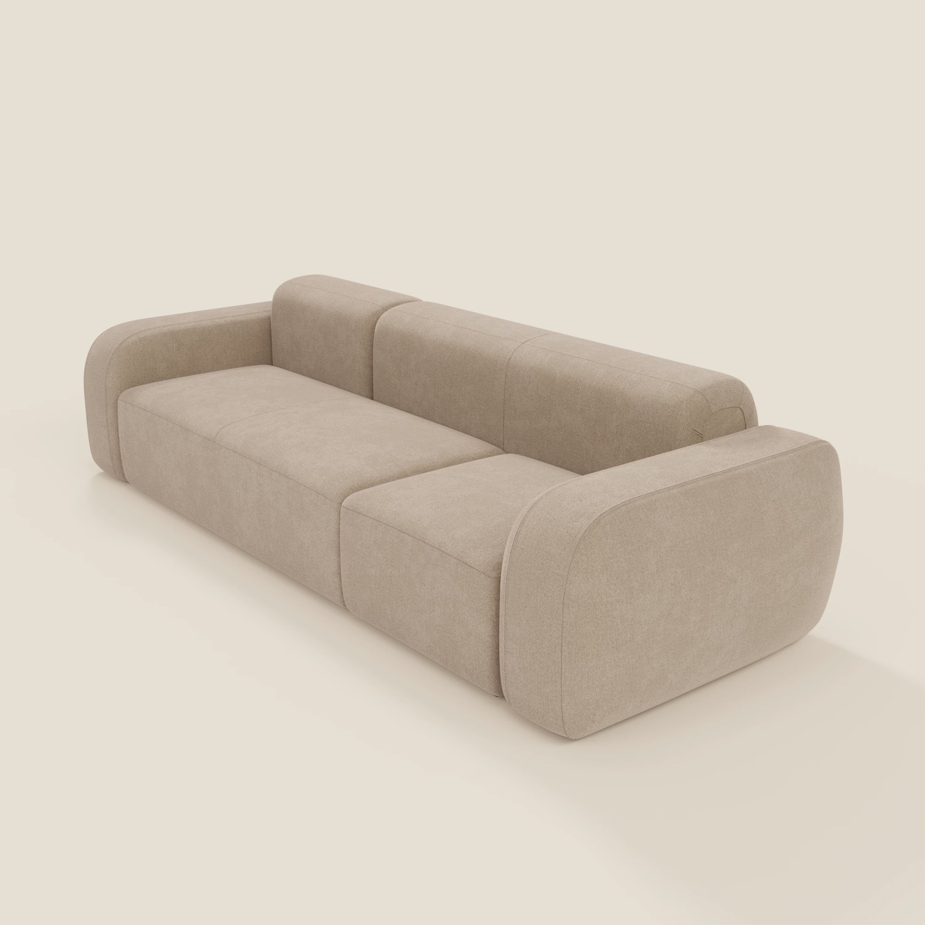 Il BonBon Divano modulare componibile - Composizione Spaccamattone di Divani.Store in smacchiabile T23 beige è caratterizzato da braccioli e schienale arrotondati, morbida imbottitura e un design minimalista e squadrato con un aspetto basso e senza gambe visibili.