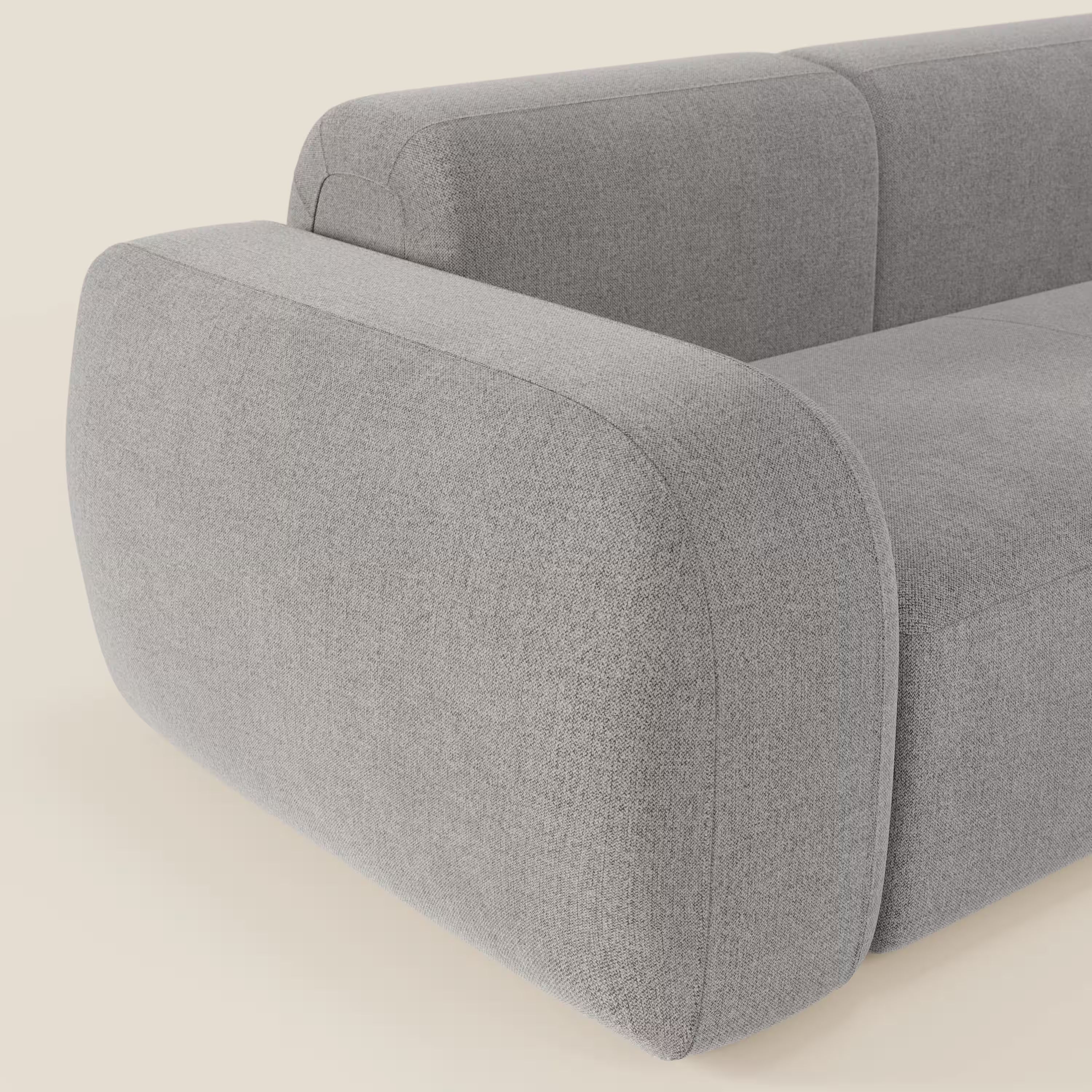 Un primo piano del BonBon Divano componibile - Composizione Spaccamattone in tessuto smacchiabile T23 grigio di Divani.Store, che mette in evidenza i suoi dettagli modulari eleganti e raffinati.