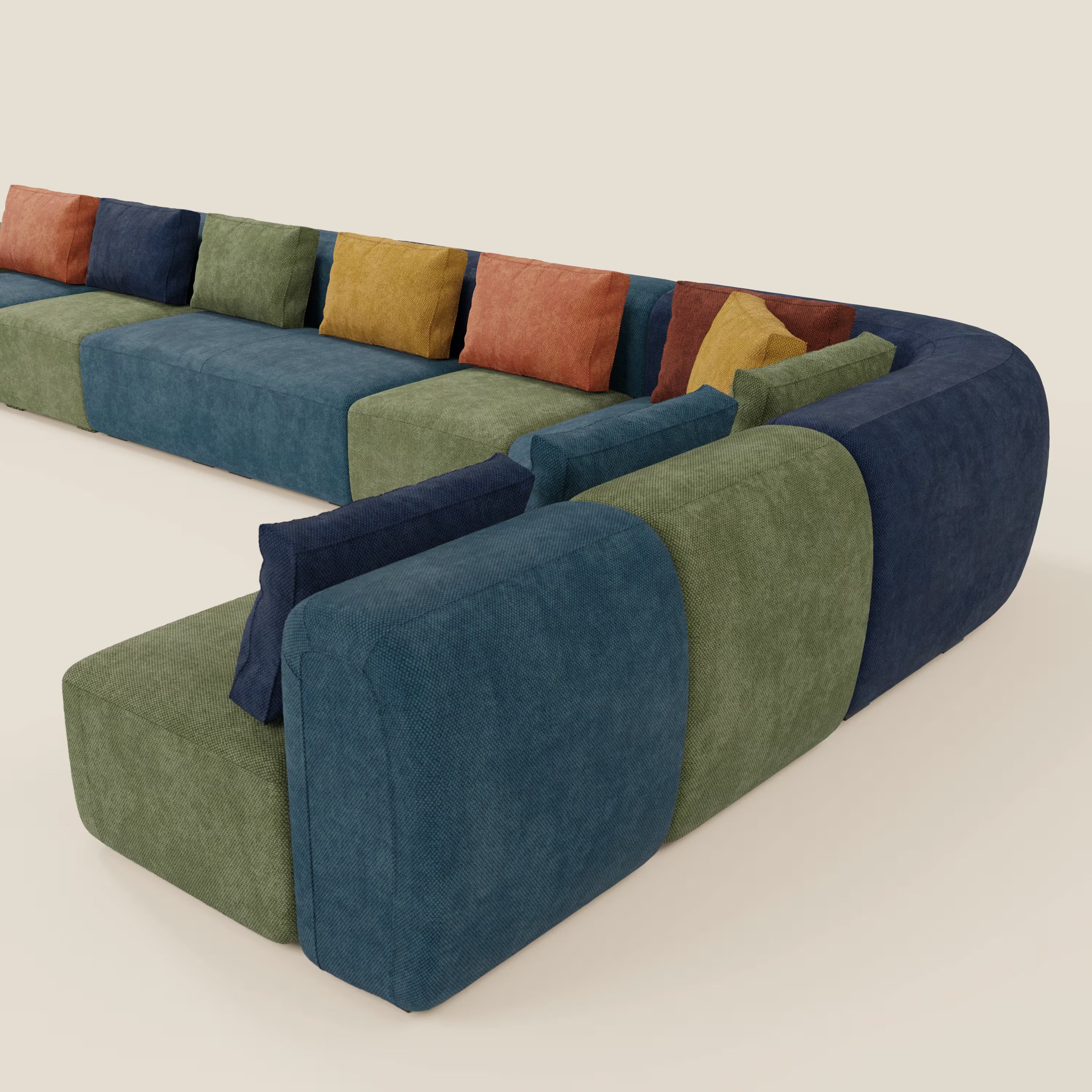 Il BonBon Grande Fratello Edition di Divani.Store è un divano modulare moderno con cuscini in tessuto blu navy, verde oliva e verde acqua, accentuati da cuscini quadrati in giallo senape, arancio bruciato, rosso e blu navy.