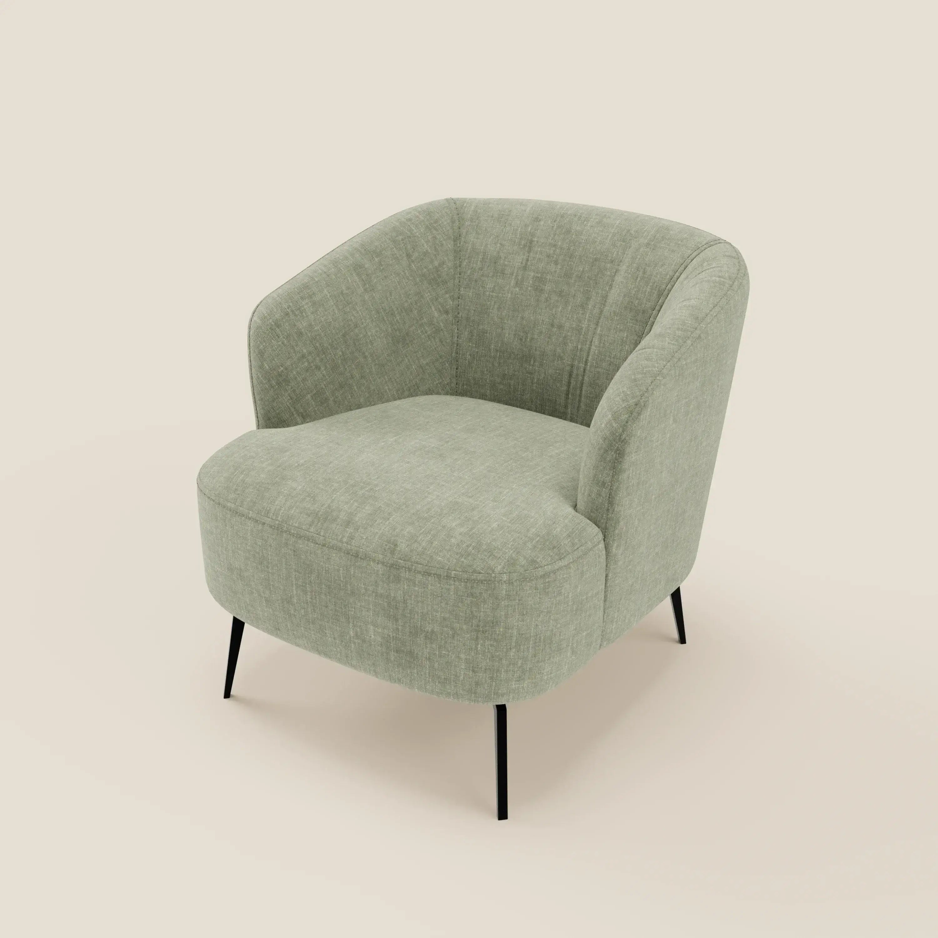 La poltroncina Renoa di Divani.Store, in tessuto smacchiabile T24 verde salvia, è caratterizzata da schienale e seduta arrotondati, sottili gambe in metallo nero e un comfort avvolgente che ne sottolinea l'eleganza moderna su un semplice sfondo bianco sporco.