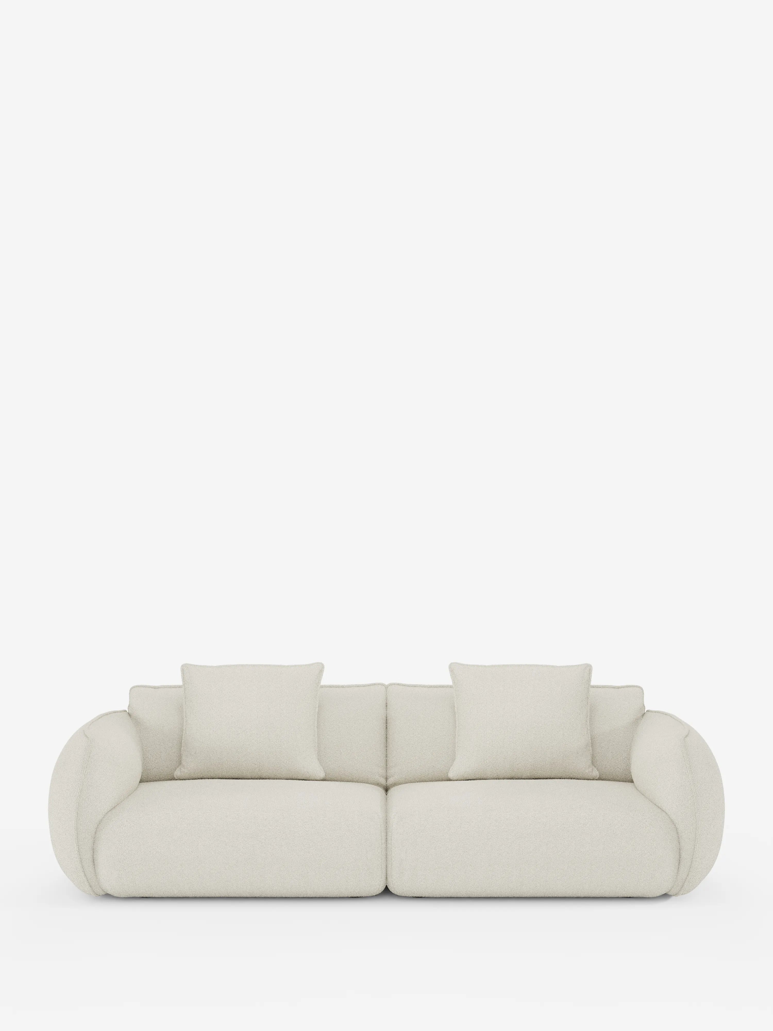 Vi presentiamo il divano Nimbus, un modello modulare e componibile a 3 posti di Divani.Store: un divano moderno e minimalista in beige chiaro, con braccioli arrotondati e due cuscini di seduta. Questo divano modulare da 250 cm è rivestito in tessuto effetto cotone (T33) sfoderabile e resistente alle macchie, include due cuscini quadrati coordinati per lo schienale ed è presentato su uno sfondo bianco a tinta unita per un’estetica pulita e contemporanea.