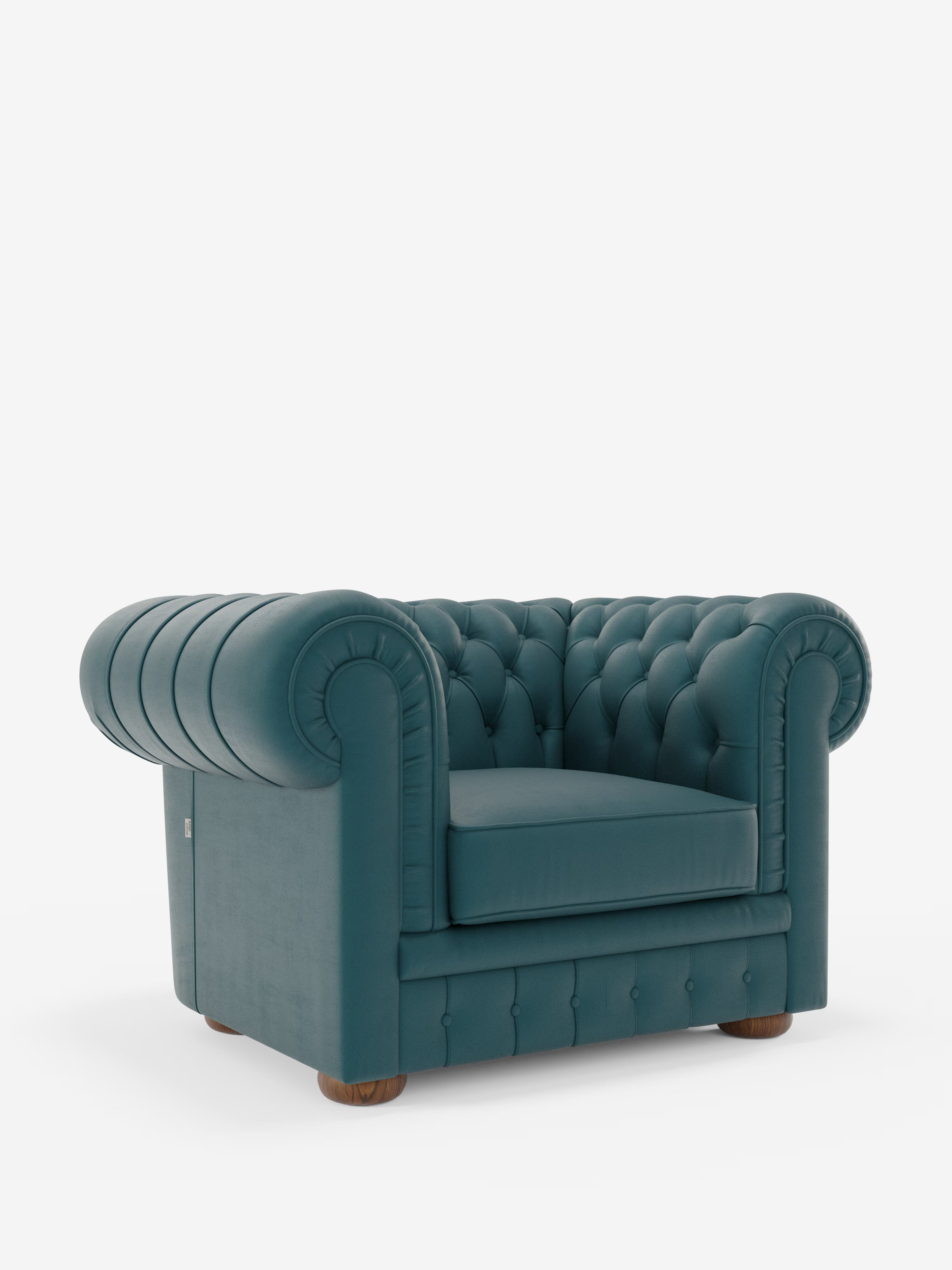 Una poltrona Chester color verde acqua in vera pelle spessorata con capitonné artigianale di Divani.Store, caratterizzata da una profonda trapuntatura a bottoni, braccioli arrotondati e piedini a pallina in legno. Per mettere in risalto la sua lavorazione artigianale, la poltrona è posizionata su uno sfondo bianco che ne esalta il design classico e lussuoso.