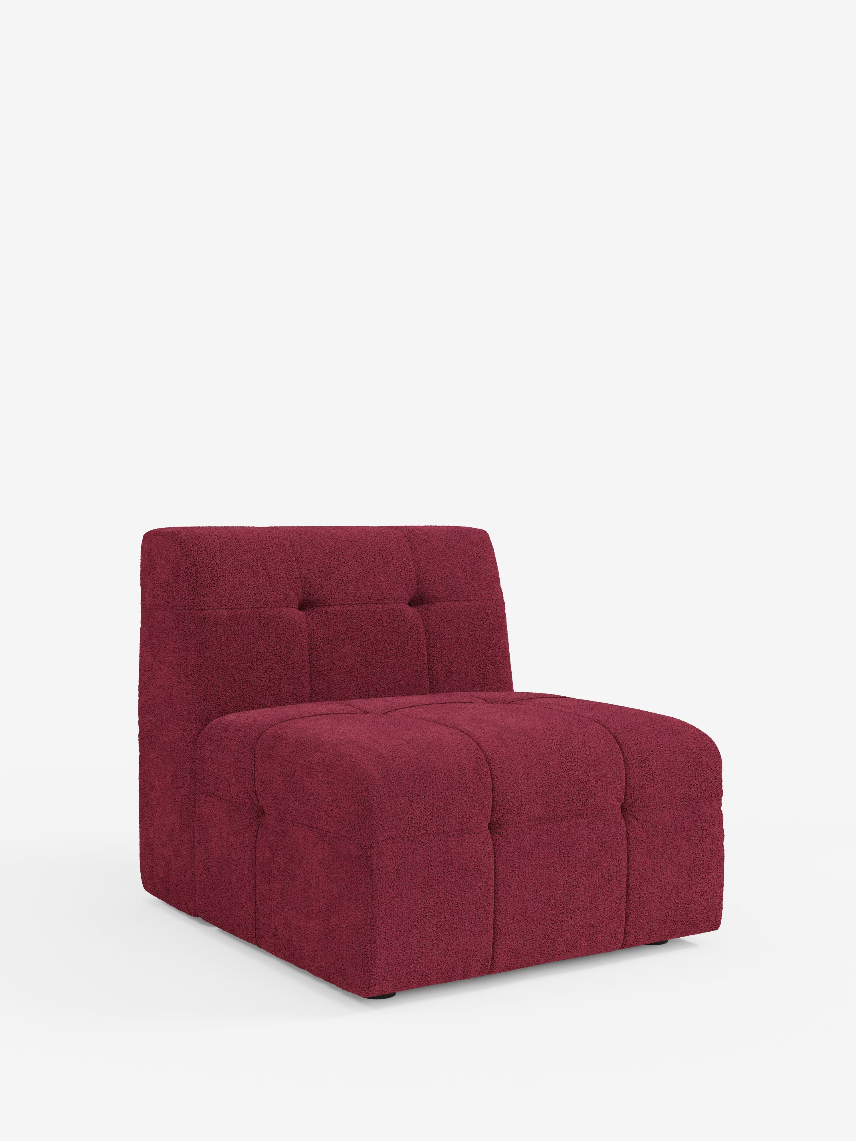 Una poltrona di design contemporaneo senza braccioli di Divani.Store, la poltrona Mosaic modulo (77 cm), rivestita in tessuto bouclé T21 rosso intenso e resistente alle macchie, con dettagli capitonné sul sedile e sullo schienale. Presentata su uno sfondo bianco, questa poltrona si caratterizza per la silhouette squadrata e il profilo ribassato, incarnando un design italiano moderno, accogliente e raffinato.