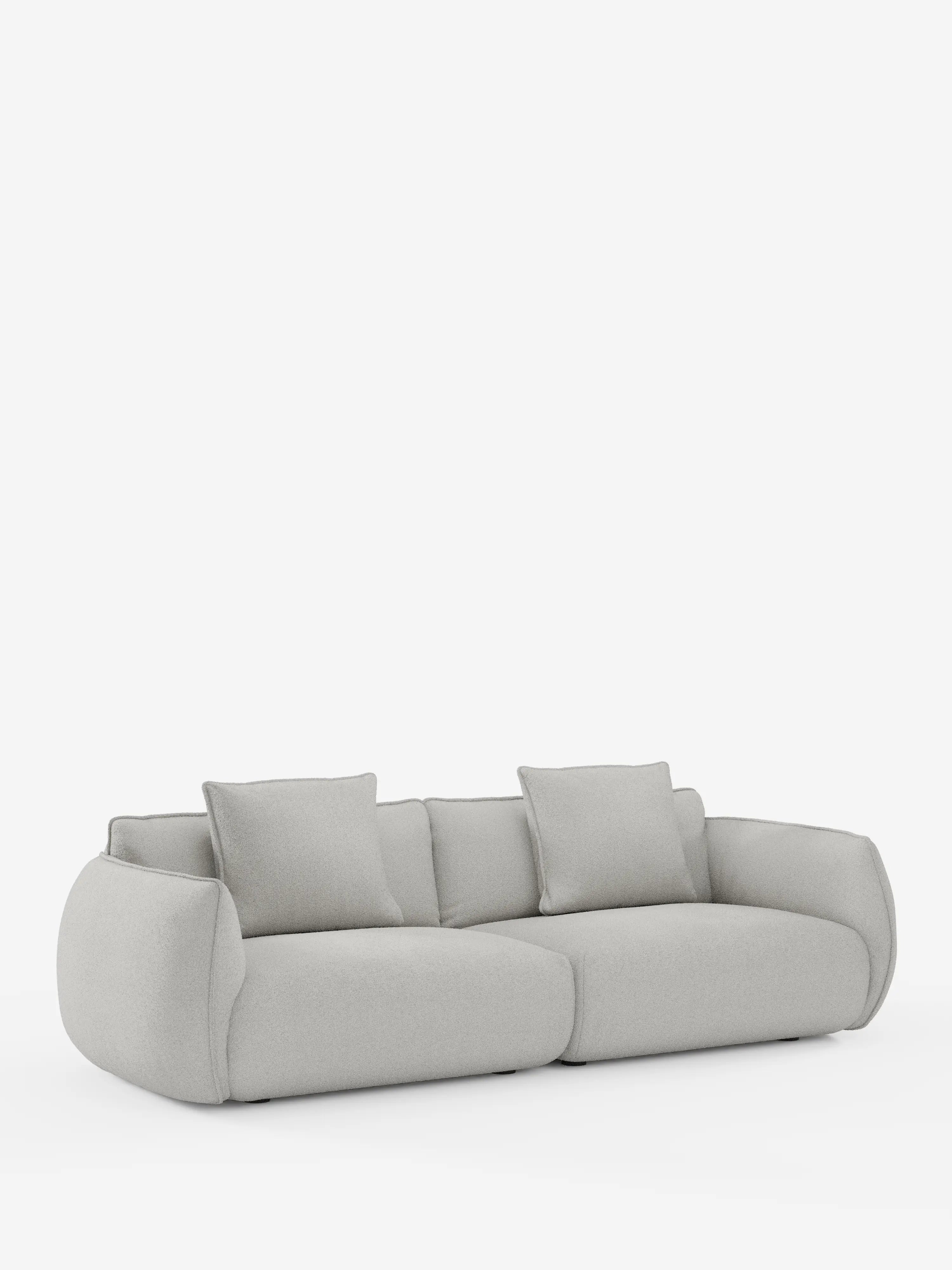 Un divano Nimbus contemporaneo a 3 posti, modulare e componibile, firmato Divani.Store, realizzato in tessuto effetto cotone grigio chiaro resistente alle macchie (t33). Questo divano si caratterizza per il profilo basso, i bordi arrotondati e i morbidi cuscini imbottiti. Comprende quattro cuscini di seduta e due cuscini dello schienale abbinati. In primo piano su uno sfondo bianco a tinta unita, spicca il design minimalista di questo divano sfoderabile da 250 cm.
