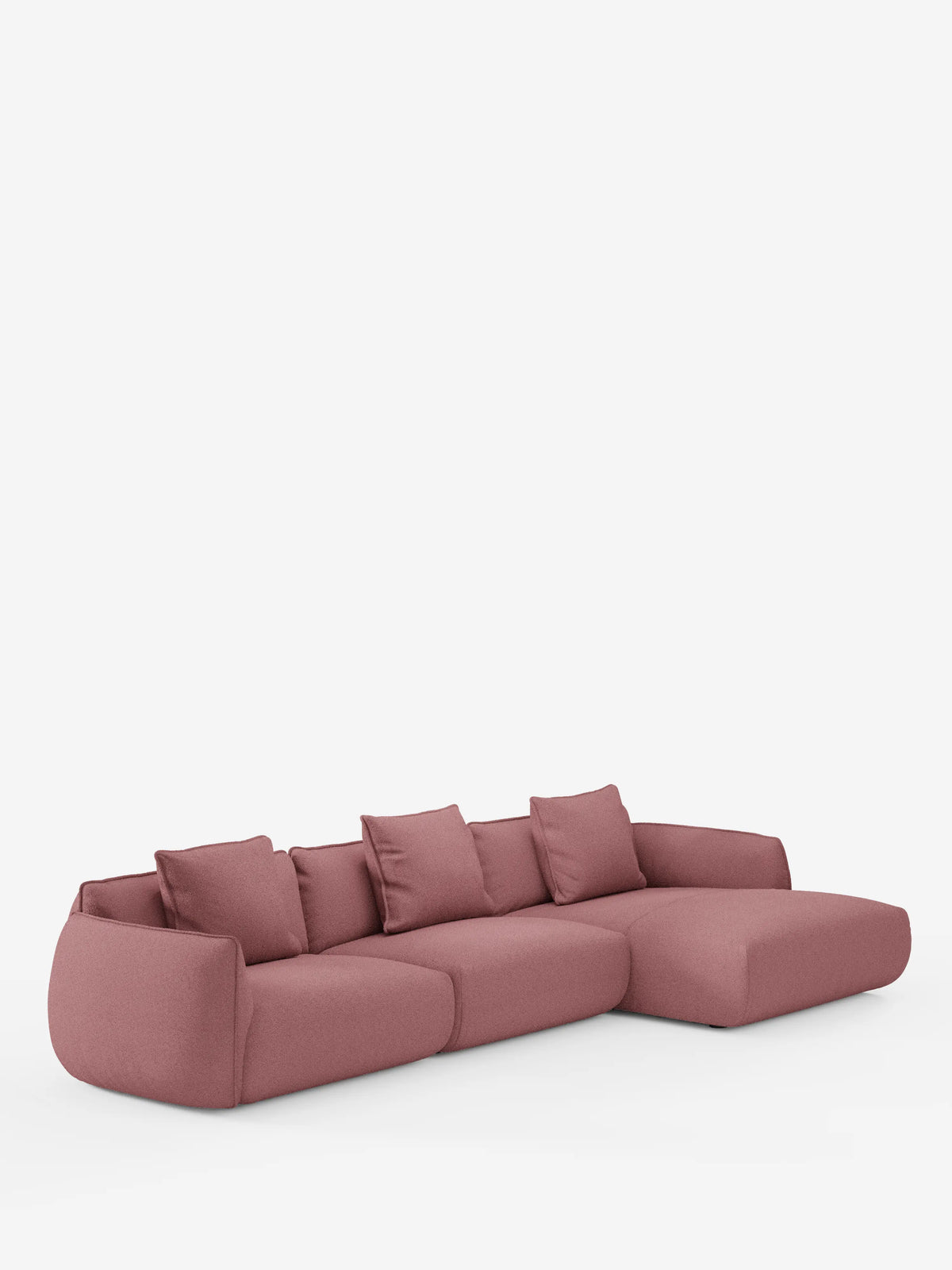 Vi presentiamo il divano angolare con penisola componibile Nimbus di Divani.Store, un divano modulare contemporaneo realizzato in morbido tessuto T33 effetto cotone, resistente alle macchie. Disponibile in una tonalità di rosa tenue, questo divano moderno include quattro cuscini schienale coordinati e presenta bordi delicatamente arrotondati. La configurazione prevede un’estensione a chaise longue sul lato destro e poggia su una base bianca senza gambe o piedini a vista.