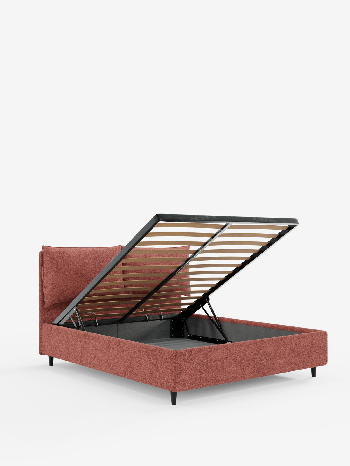 Il letto imbottito ZAYRON con contenitore e morbidi cuscini regolabili di Letti.store presenta un design moderno in tessuto certificato Oeko-Tex®, qui raffigurato nella tonalità “dusty rose” con struttura e testiera imbottite. La piattaforma del materasso si solleva per rivelare un ampio vano contenitore sottostante, mentre il letto poggia su gambe corte e inclinate di colore nero, che risaltano sullo sfondo bianco liscio.