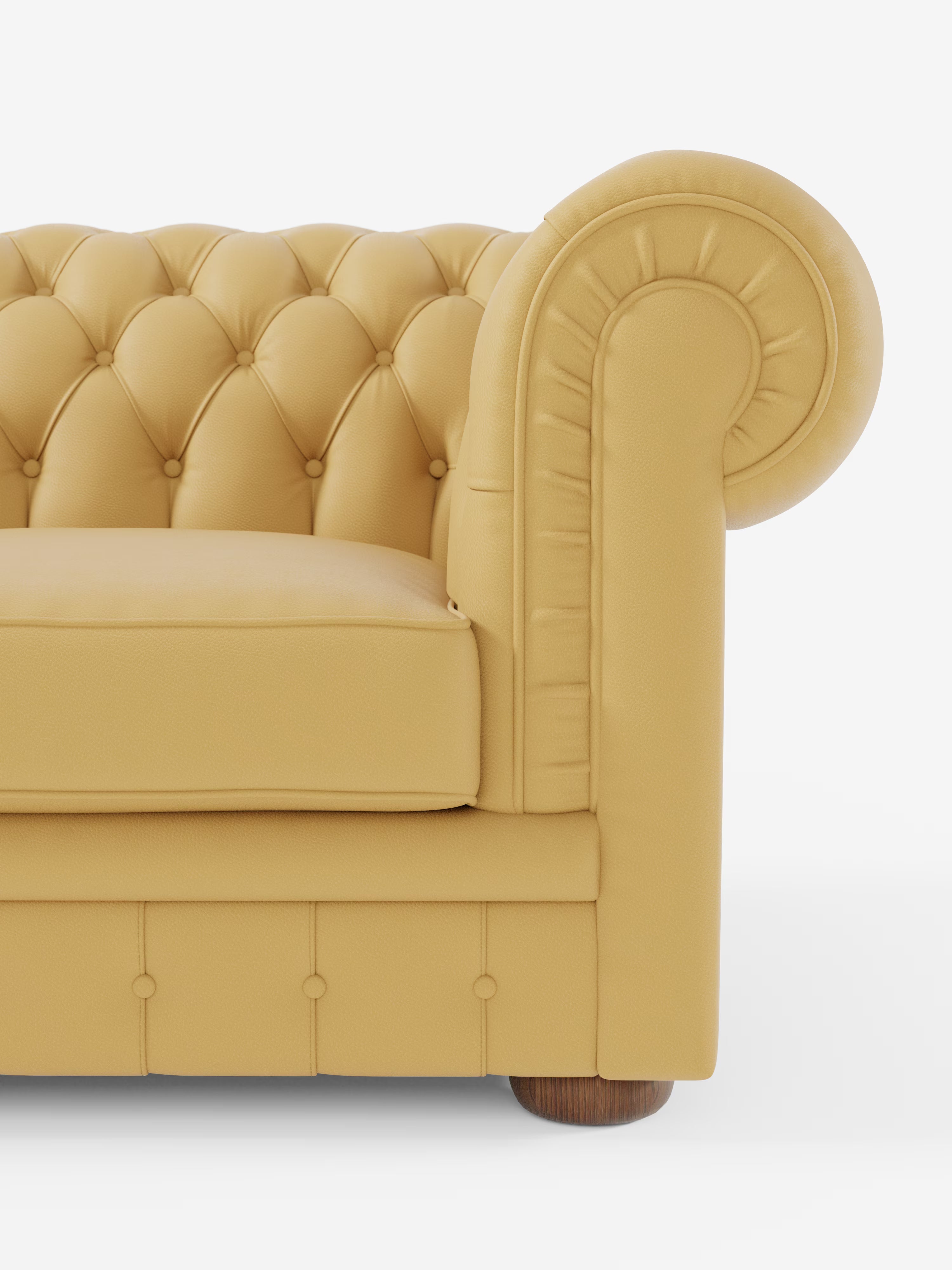 Un primo piano del divano Chester – Divano Chesterfield in vera pelle spessorata a 2 e 3 posti di Divani.Store, caratterizzato da rivestimento in pelle gialla, schienale capitonné, ampi braccioli arrotondati, seduta imbottita, dettagli con bottoni e un piccolo piedino in legno su sfondo bianco.
