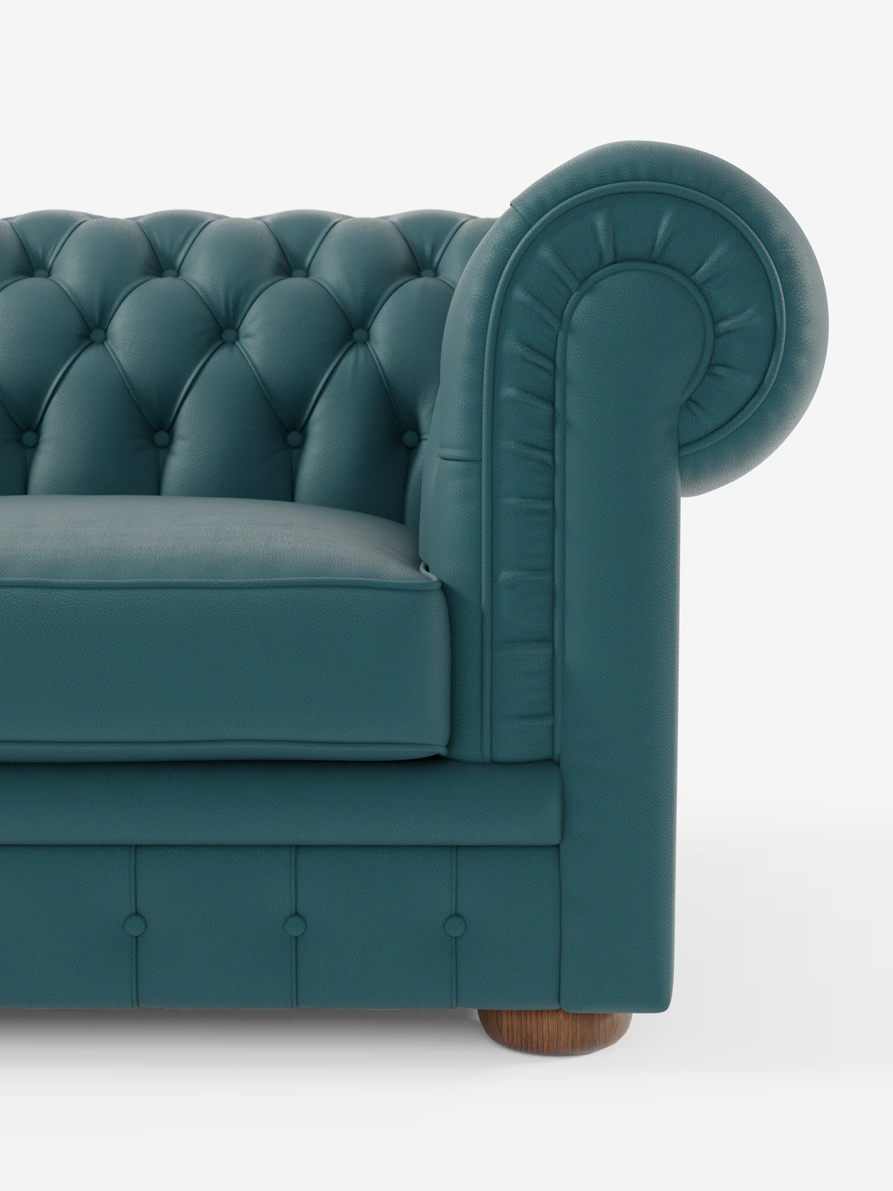 Primo piano di un divano Chesterfield color verde acqua con imbottitura a ciuffetti – Divano Chesterfield in vera pelle spessorata a 2 e 3 posti di Divani.Store, che mette in risalto il bracciolo arrotondato, lo schienale con bottoni profondi, il cuscino di seduta e parte della gamba in legno, il tutto su uno sfondo bianco. Questo divano artigianale senza tempo Made in Italy di Divani.Store trasuda eleganza e maestria artigianale.