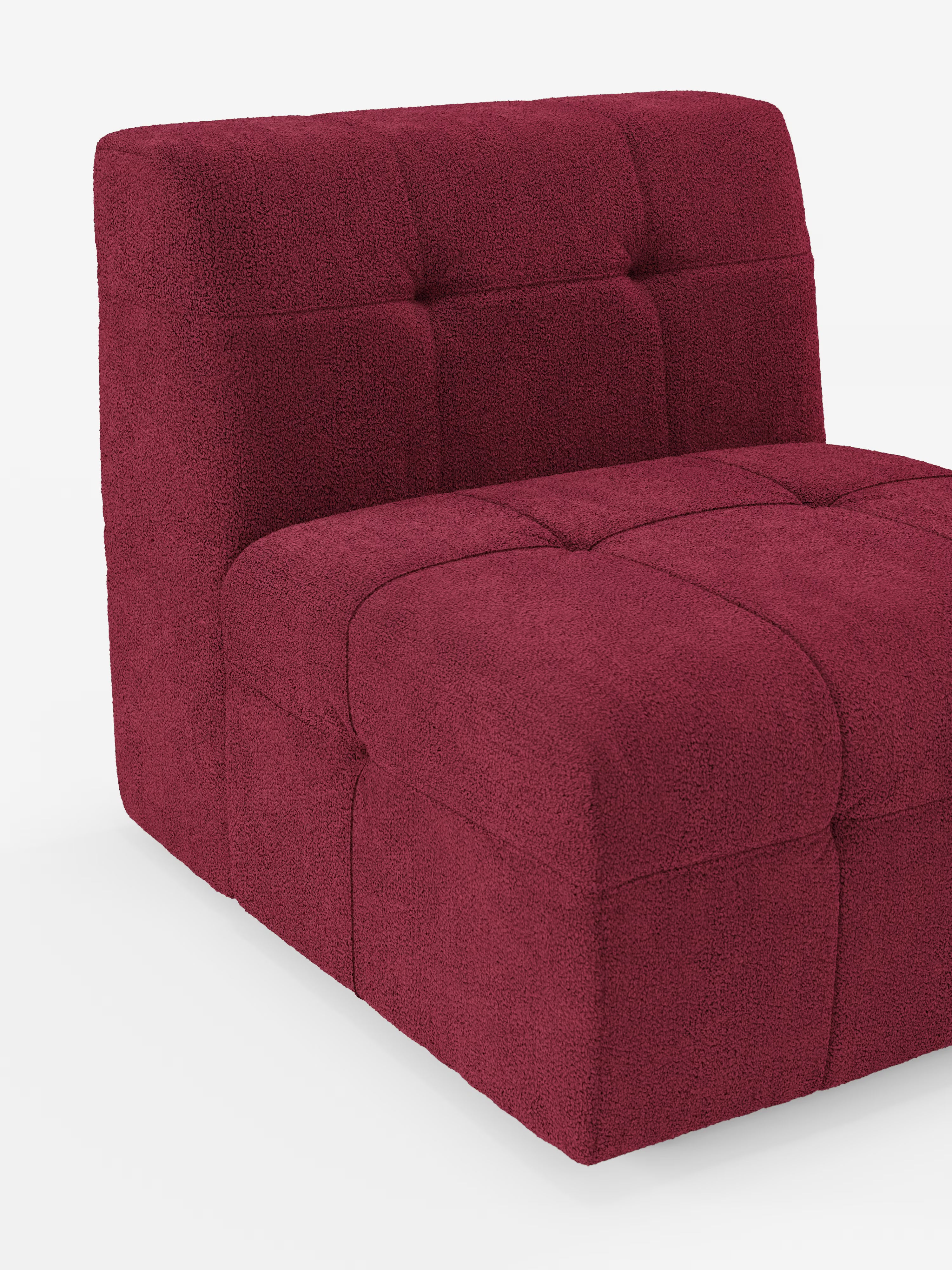 Vi presentiamo la poltrona Mosaic Modulo di Divani.Store: una poltrona contemporanea senza braccioli, alta 77 cm e rivestita in Tessuto Bouclé T21 color bordeaux intenso, resistente alle macchie. La seduta e lo schienale presentano una trapuntatura capitonné a quadrati, che esalta il design intramontabile della poltrona. Con un profilo basso e squadrato, linee pulite e bordi delicatamente arrotondati, questo complemento d’arredo incarna l’eleganza moderna. Prodotto in Italia.