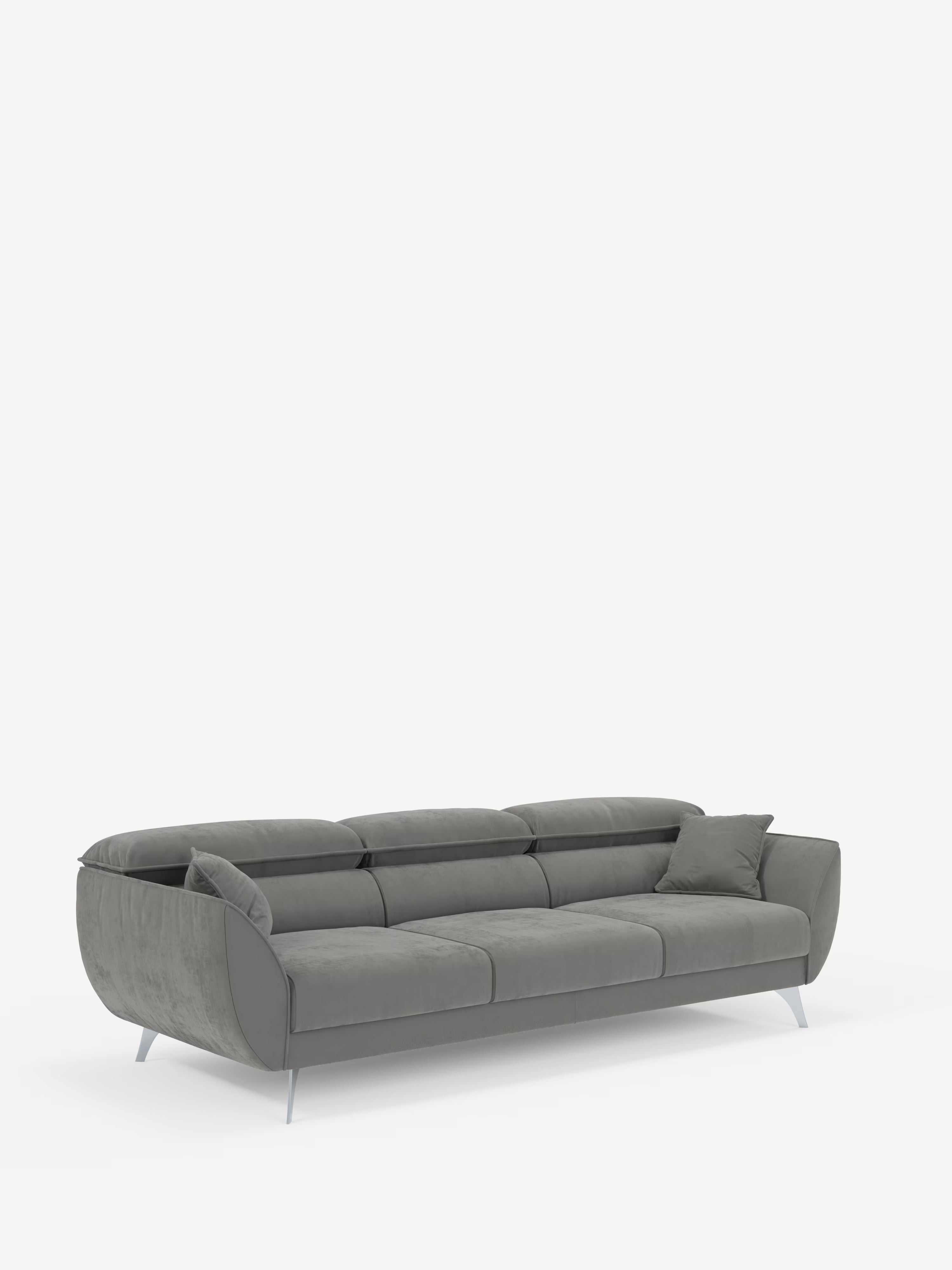 Un divano grigio contemporaneo a 4 posti, il modello Michelangelo di Divani.Store, è dotato di tre sedute estensibili e poggiatesta reclinabili, rivestiti in elegante tessuto T30 in velluto antimacchia. Con la sua silhouette slanciata e sinuosa, le sottili gambe in metallo, il morbido rivestimento e un cuscino grigio abbinato posizionato sul lato destro, il design risalta su uno sfondo bianco a tinta unita, conferendo al divano un look decisamente moderno.