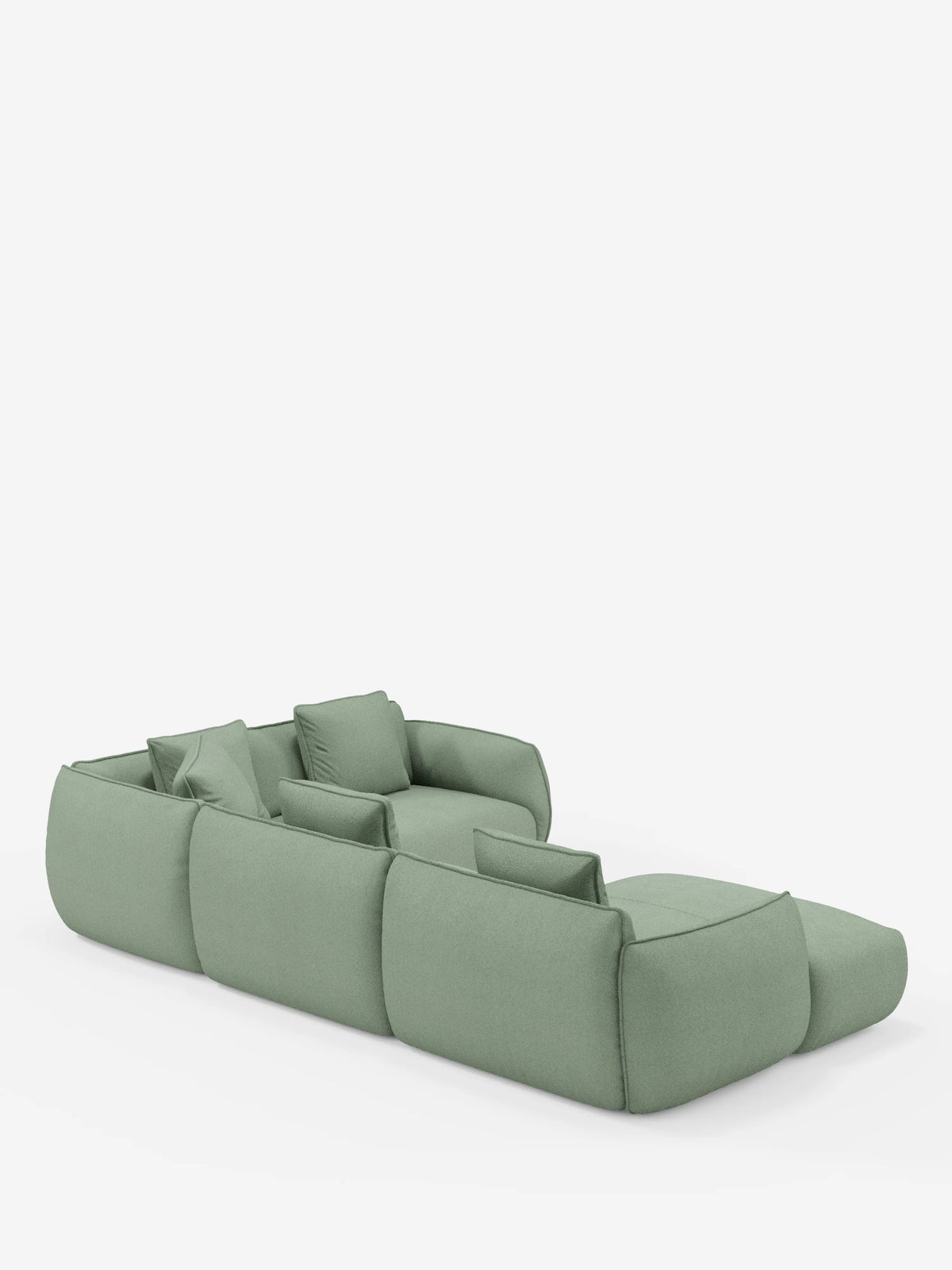 Divano angolare panoramico modulare a tre posti Nimbus con penisola e angolo, rivestito in tessuto verde chiaro resistente alle macchie (t33), di Divani.Store. Questo divano Made in Italy presenta bordi arrotondati e cuscini coordinati, qui raffigurato in una prospettiva posteriore. Su uno sfondo bianco a tinta unita, il suo design senza gambe a vista gli conferisce un aspetto discreto e contemporaneo.