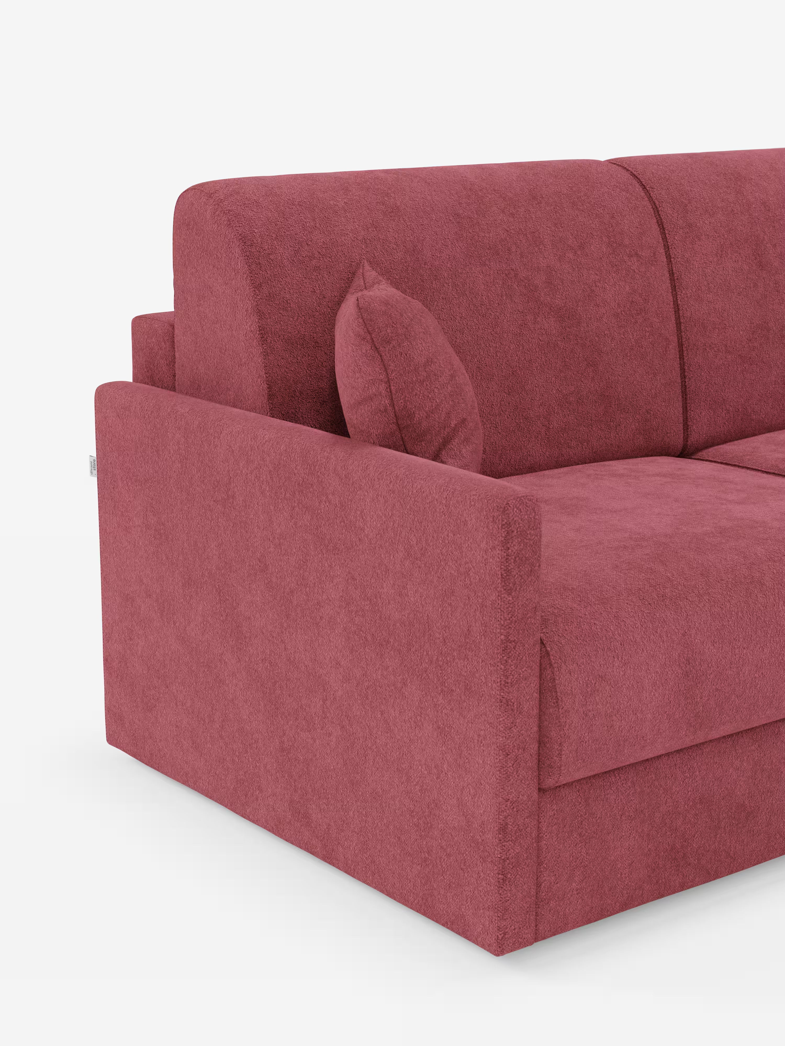 Un primo piano del divano letto Tommy a 2 e 3 posti matrimoniale di Divani.Store, un divano moderno e lussuoso rivestito in tessuto T33 rosso, simile al cotone e resistente alle macchie, con un cuscino coordinato sulla seduta. Questo divano, sfoderabile al 100%, presenta linee pulite e braccioli squadrati, che risaltano su uno sfondo bianco a tinta unita. Sono visibili solo il lato sinistro e una parte dello schienale.