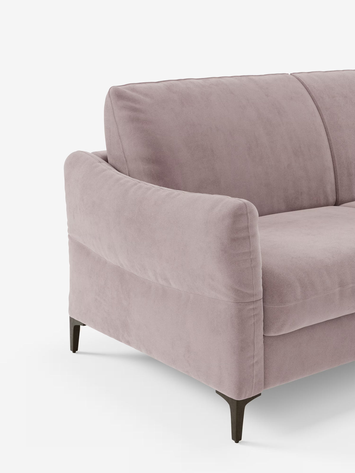 Un primo piano dettagliato del divano letto Dalia di Divani.Store, qui presentato in un tessuto “vellutino moderno” T30 color malva chiaro e resistente alle macchie. Questo divano letto contemporaneo a 2, 3 o 4 posti è caratterizzato da un’imbottitura morbida, braccioli leggermente ricurvi e sottili gambe in metallo nero. Presentato su uno sfondo bianco a tinta unita, è dotato di un materasso alto 18 cm (materasso H18) per un comfort eccezionale durante le notti di riposo.