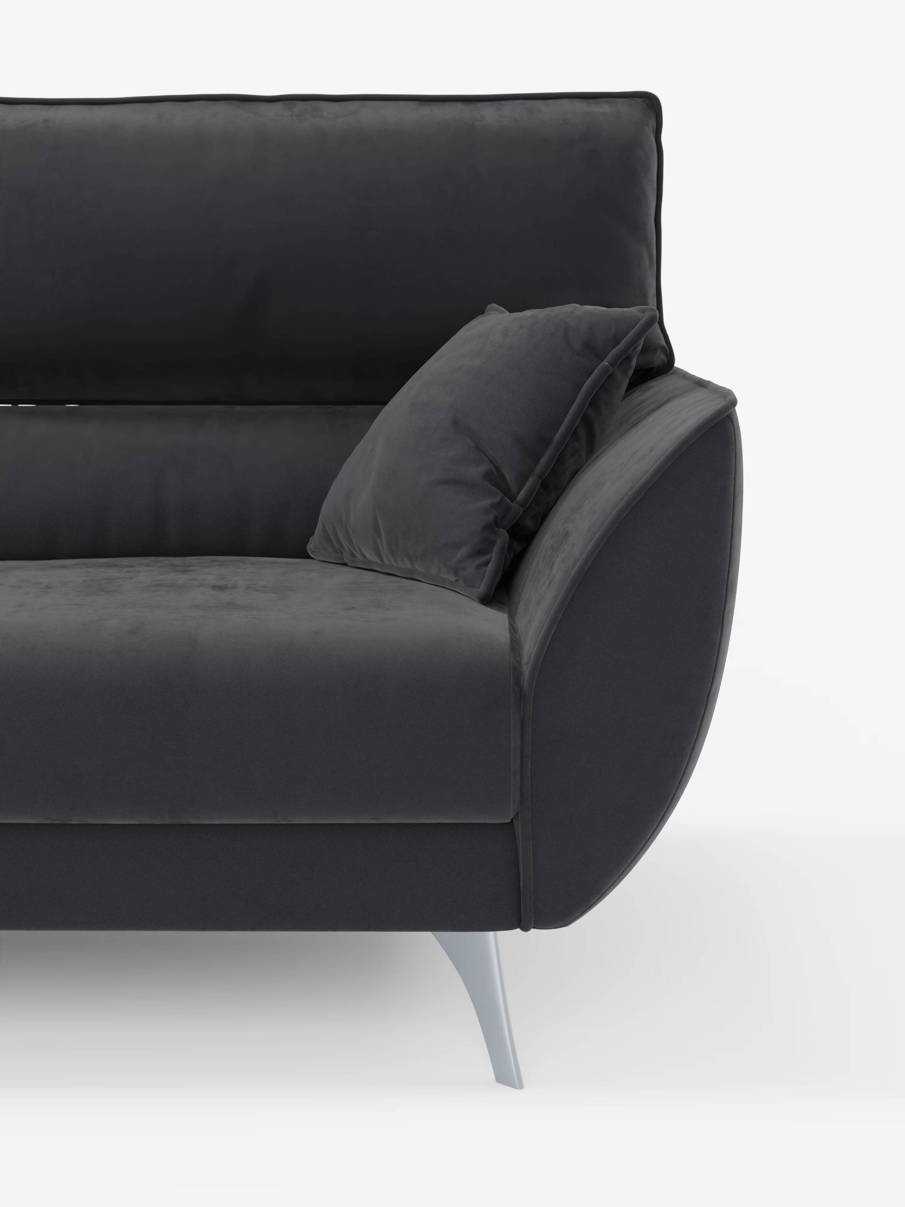 Un primo piano del divano Michelangelo 4 Posti di Divani.Store — un divano moderno di colore grigio scuro — che mostra il bracciolo destro, lo schienale e un cuscino angolare. Questo divano con 3 sedute estensibili e poggiatesta reclinabili presenta linee slanciate, un rivestimento in morbido vellutino T30 smacchiabile e gambe angolate color argento, il tutto su uno sfondo bianco.