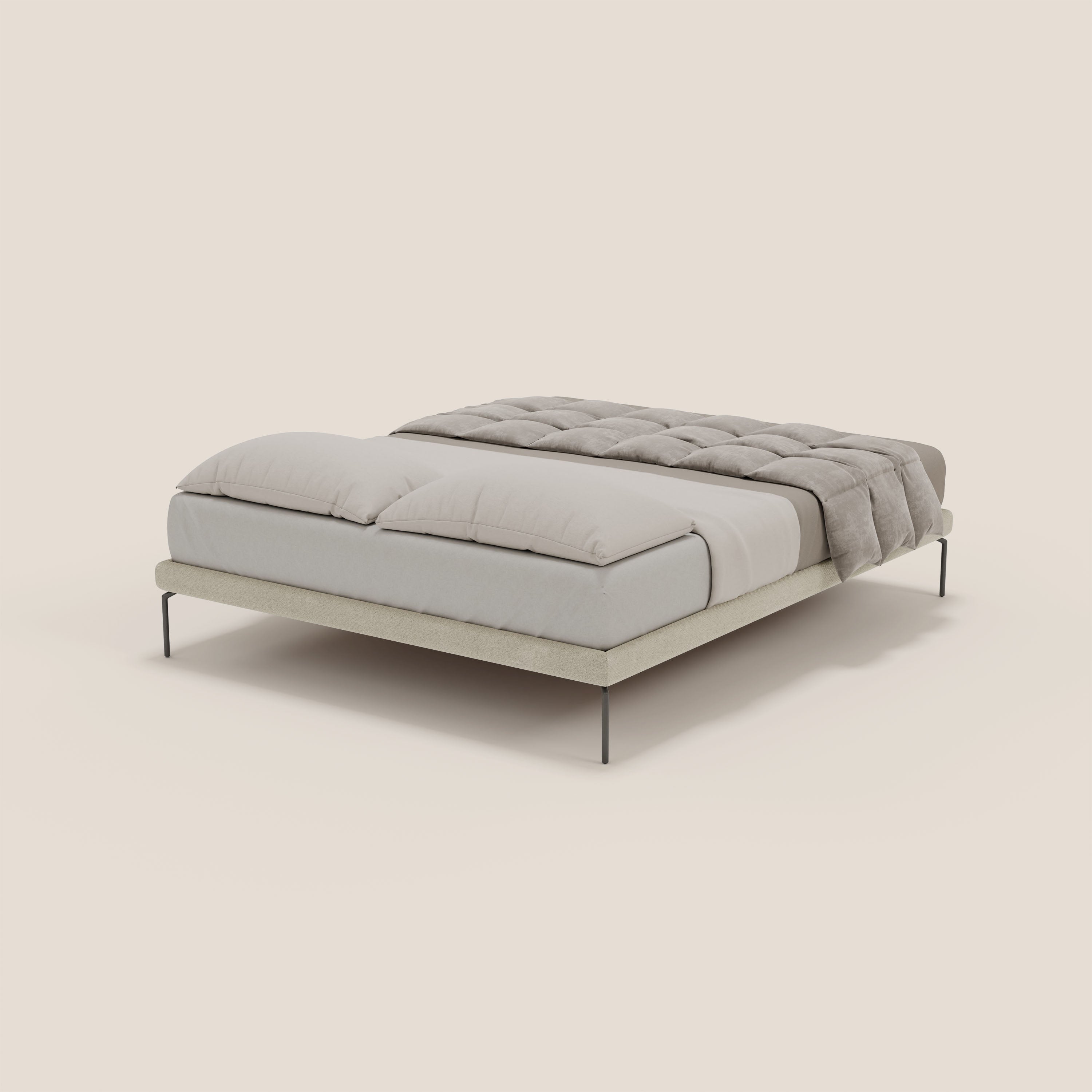 Il sommier sfoderabile Letti.store Ring è caratterizzato da gambe nere alte 24 cm e da una struttura bassa in tessuto impermeabile T14 panna, con due grandi cuscini e un piumino grigio chiaro, il tutto su uno sfondo bianco sporco.
