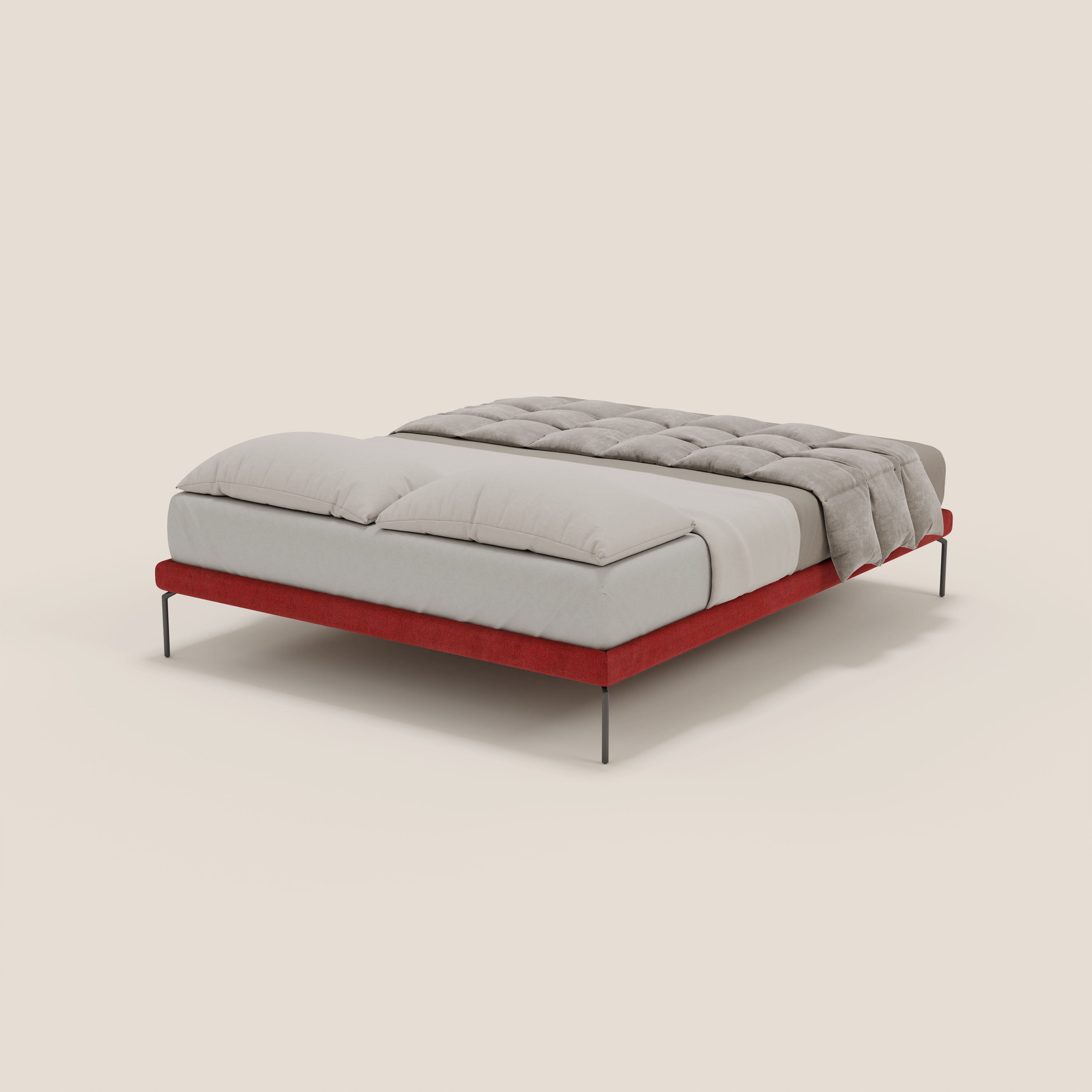 Il sommier sfoderabile Ring di Letti.store è caratterizzato da una struttura in tessuto impermeabile T14 rosso e da gambe nere sottili alte 24 cm, ordinatamente realizzate con lenzuola e piumone grigio chiaro su sfondo bianco sporco.