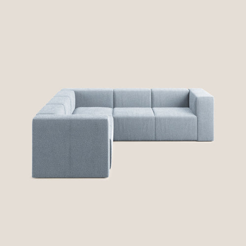 Nettuno divano angolare componibile reversibile in morbido tessuto bouclè T07 carta da zucchero - divani.store