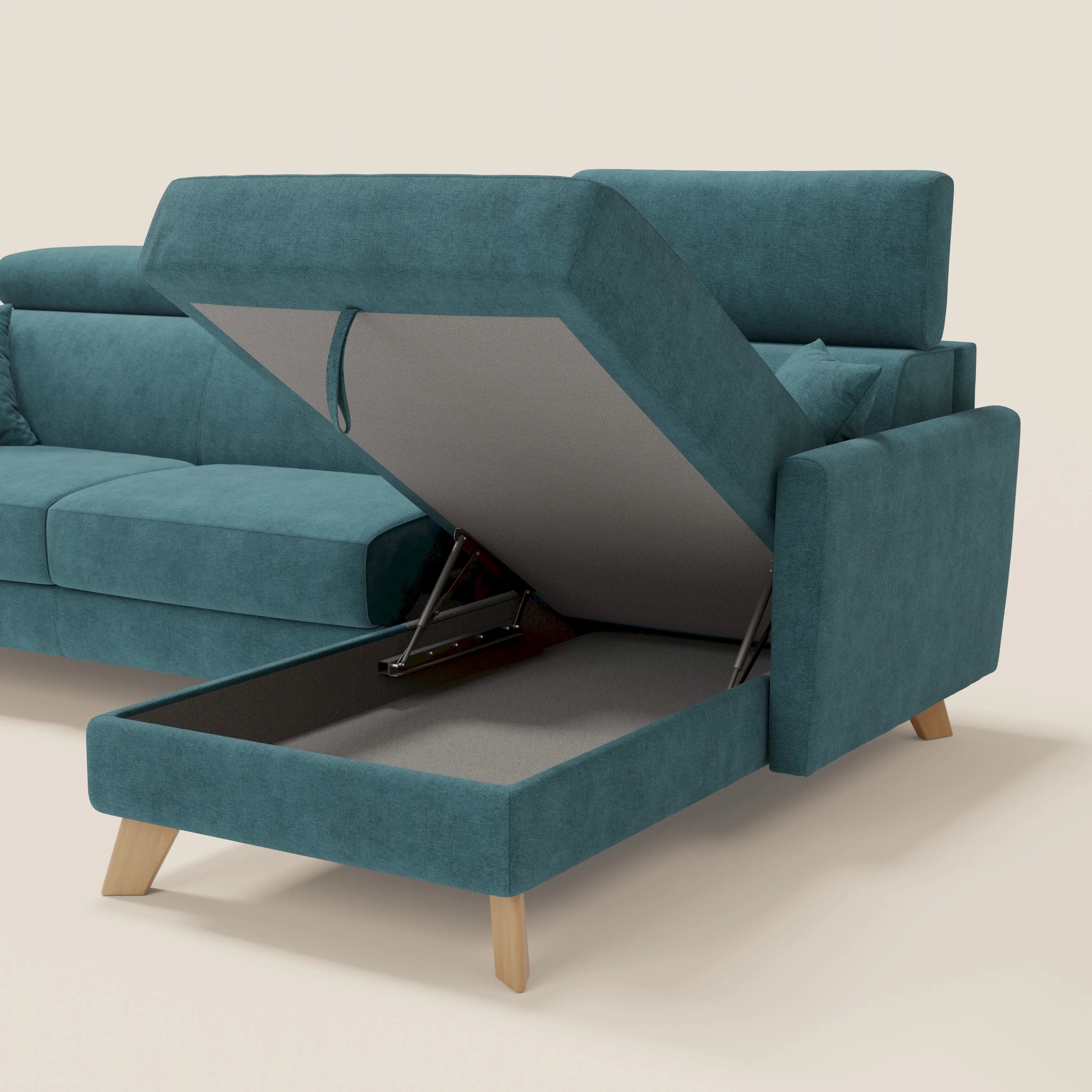Il divano letto angolare sfoderabile Francy di Divani.Store in tessuto smacchiabile T17 petrolio è caratterizzato da una penisola con contenitore e da poggiatesta regolabili, che mettono in mostra la praticità dello stile nordico su uno sfondo chiaro.