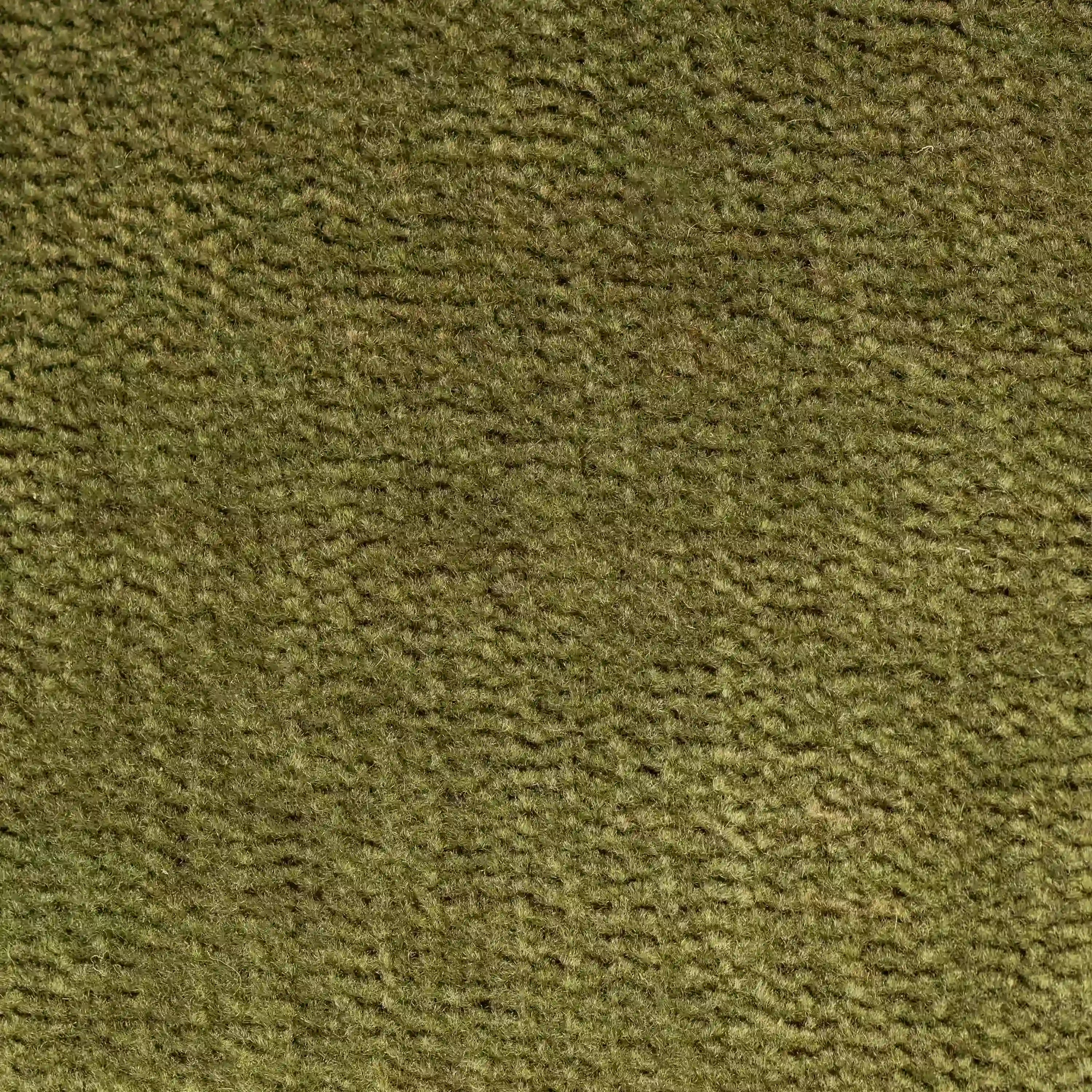 Primo piano del tessuto strutturato T31 marrone-verdastro e antimacchia della poltrona letto Rift di Divani.Store con un materasso in memory foam alto 22 cm; le fibre spesse e morbide formano una trama irregolare. Non si vedono oggetti distinti.