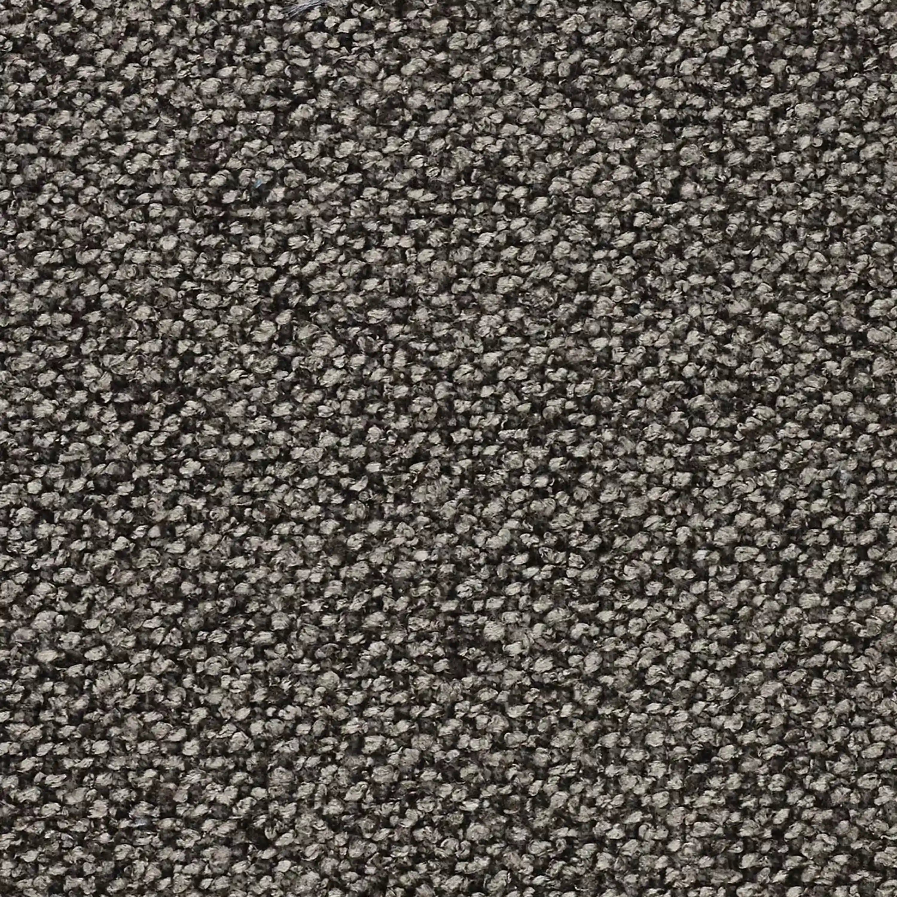 Primo piano di un tappeto grigio con fibre strette e piccole, una base raffinata per completare il vostro Divani.Store Nimbus divano angolare panoramico componibile con penisola e angolo in tessuto smacchiabile t33.