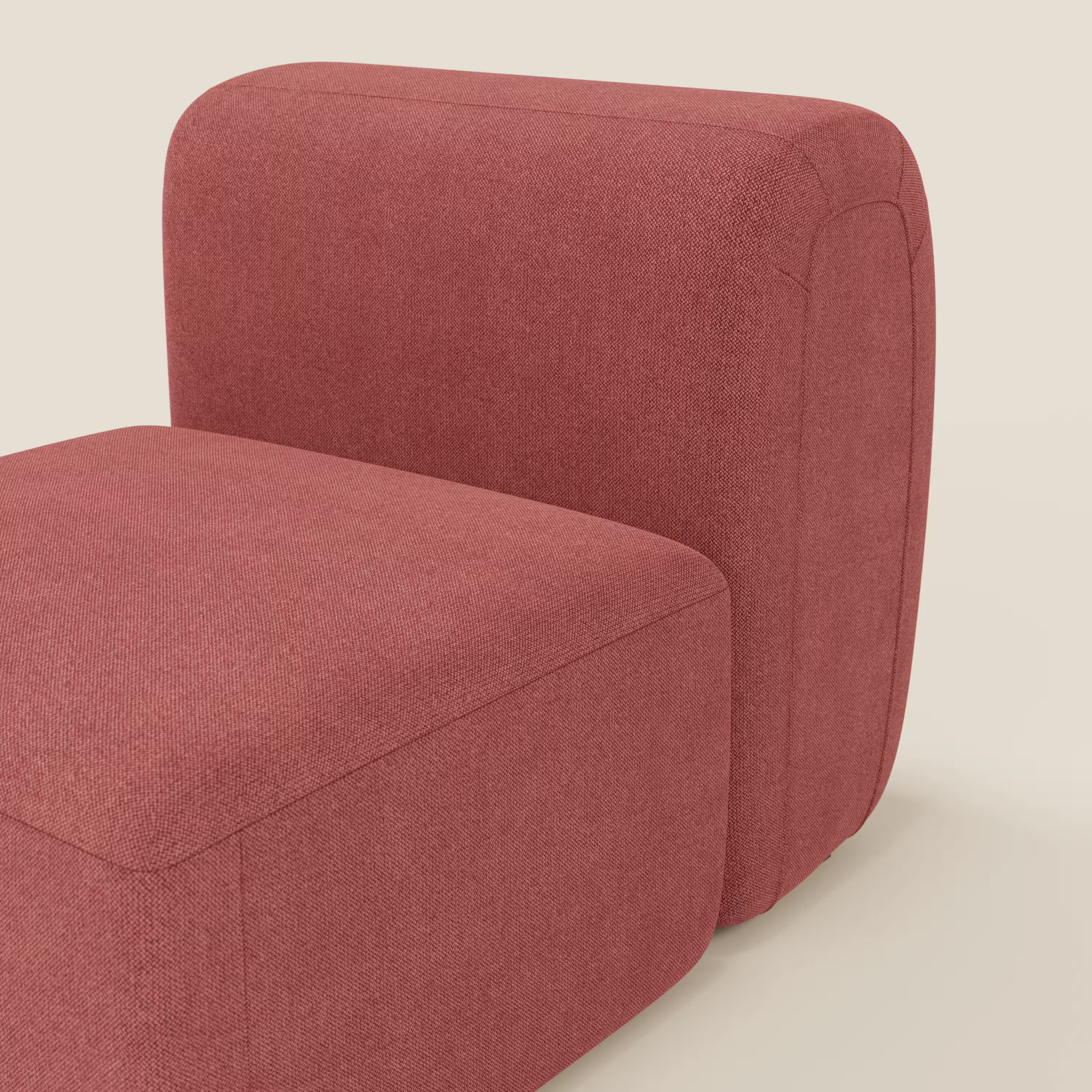 BonBon modulo centrale 70 cm di Divani.Store è una moderna poltrona o elemento modulare senza braccioli in tessuto antimacchia T23 rosso ciliegia, dal design squadrato e minimalista con bordi arrotondati e cuciture a vista su uno sfondo bianco sporco.