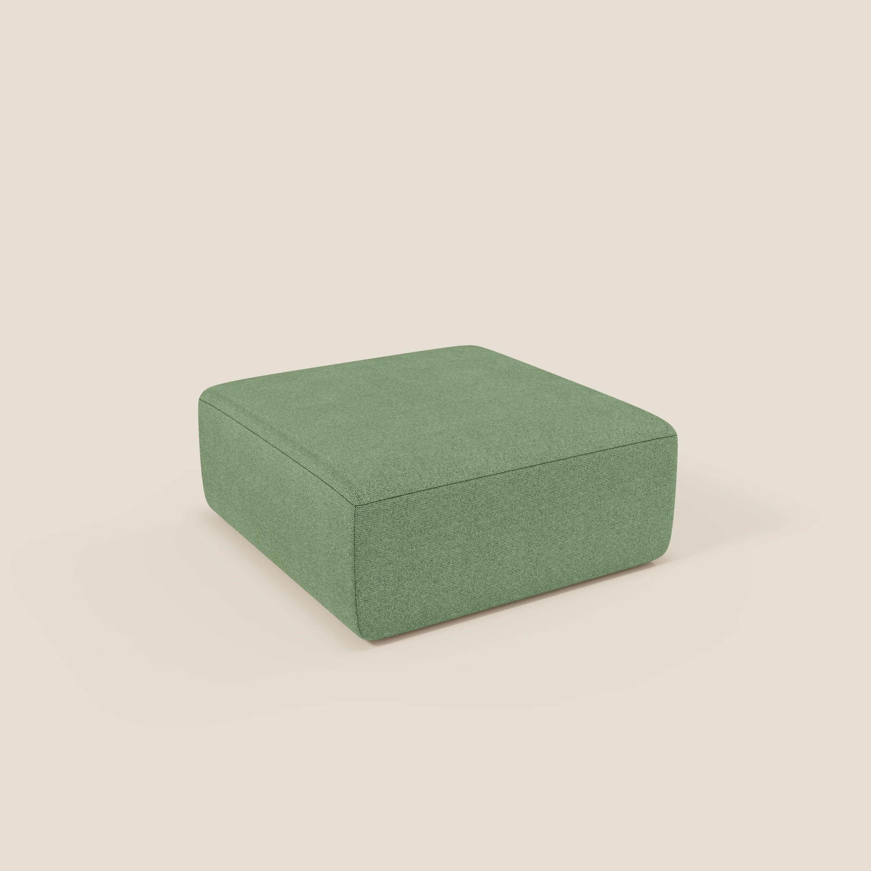 Il pouf BonBon di Divani.Store, presentato in tessuto antimacchia quadrato T23 menta, è caratterizzato da un design moderno e semplice, con linee pulite e senza gambe o abbellimenti visibili, su uno sfondo crema chiaro.