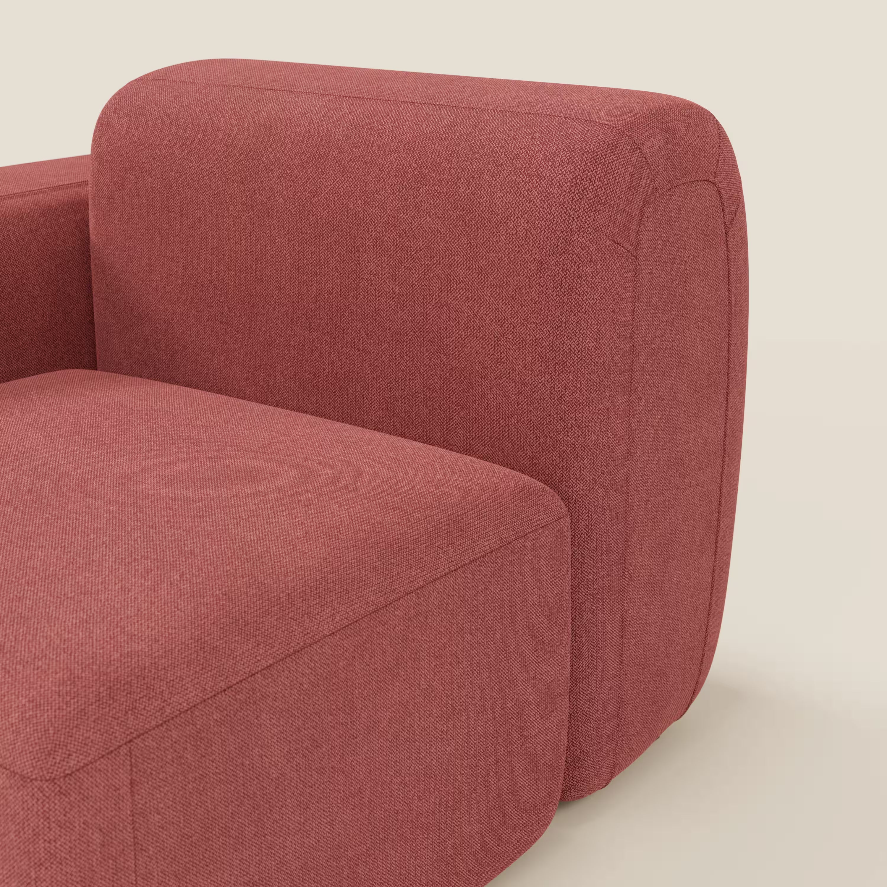 Primo piano di BonBon modulo terminale 105 cm sinistro o destro di Divani.Store in tessuto antimacchia T23 rosso ciliegia, dal design moderno e minimalista con bracciolo e seduta arrotondati su sfondo beige neutro.
