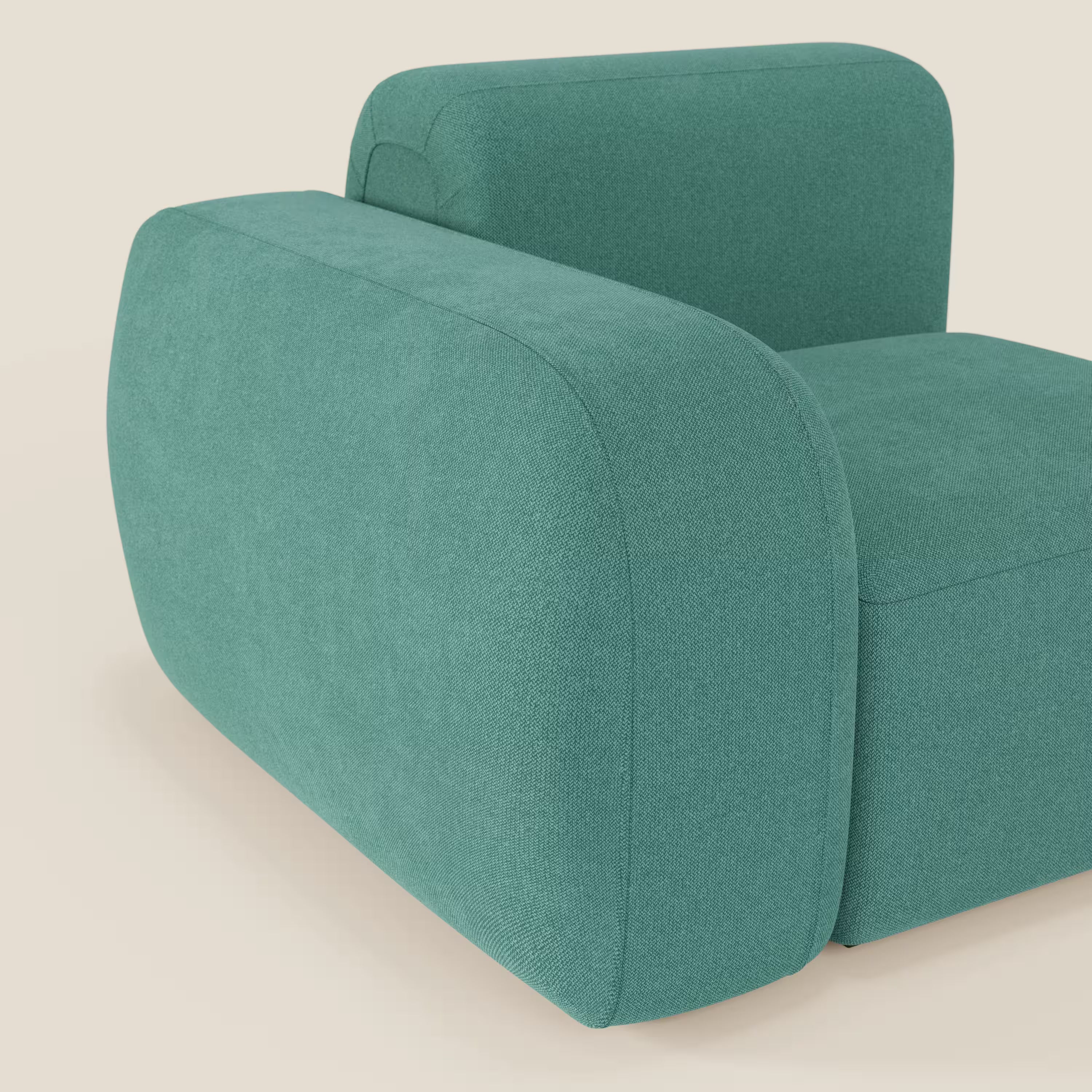 BonBon modulo terminale 105 cm di Divani.Store con cuscini spessi e arrotondati in tessuto smacchiabile T23 verde acqua. Design oversize, squadrato senza gambe visibili, su sfondo beige chiaro. Visibili solo parte della seduta e dello schienale.