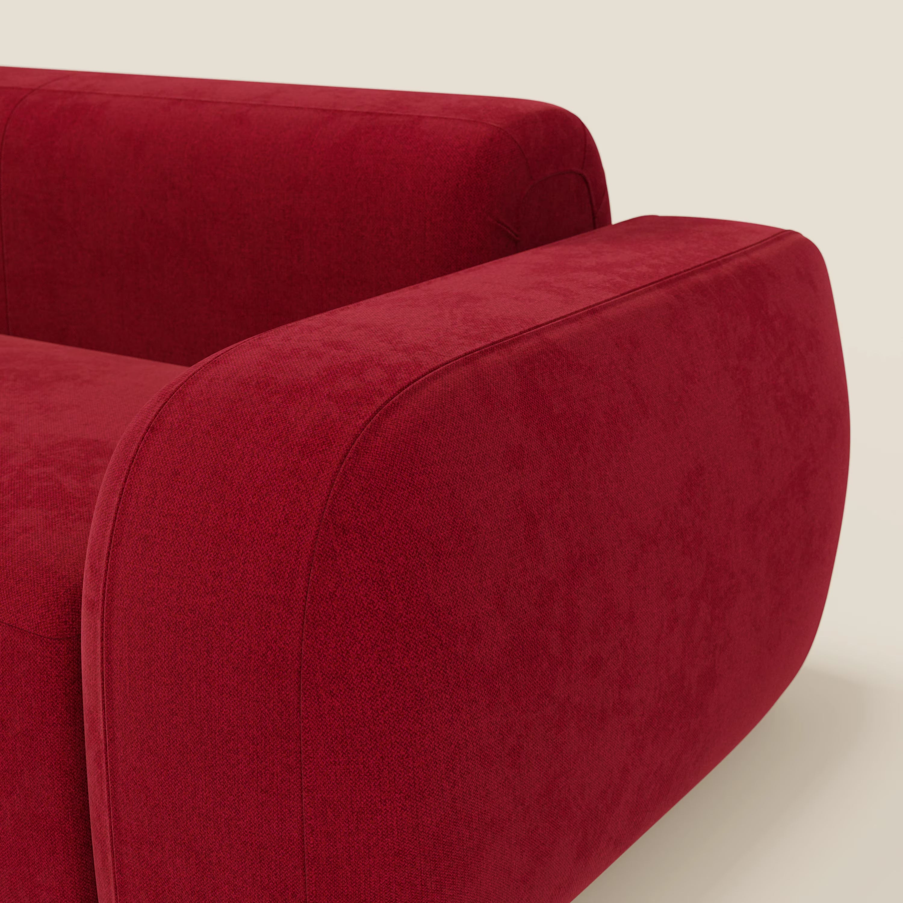 Primo piano del BonBon Divano modulare Lineare 220 di Divani.Store, caratterizzato da tessuto smacchiabile T23 bordeaux, bordi lisci e arrotondati e un design minimalista su uno sfondo beige chiaro.