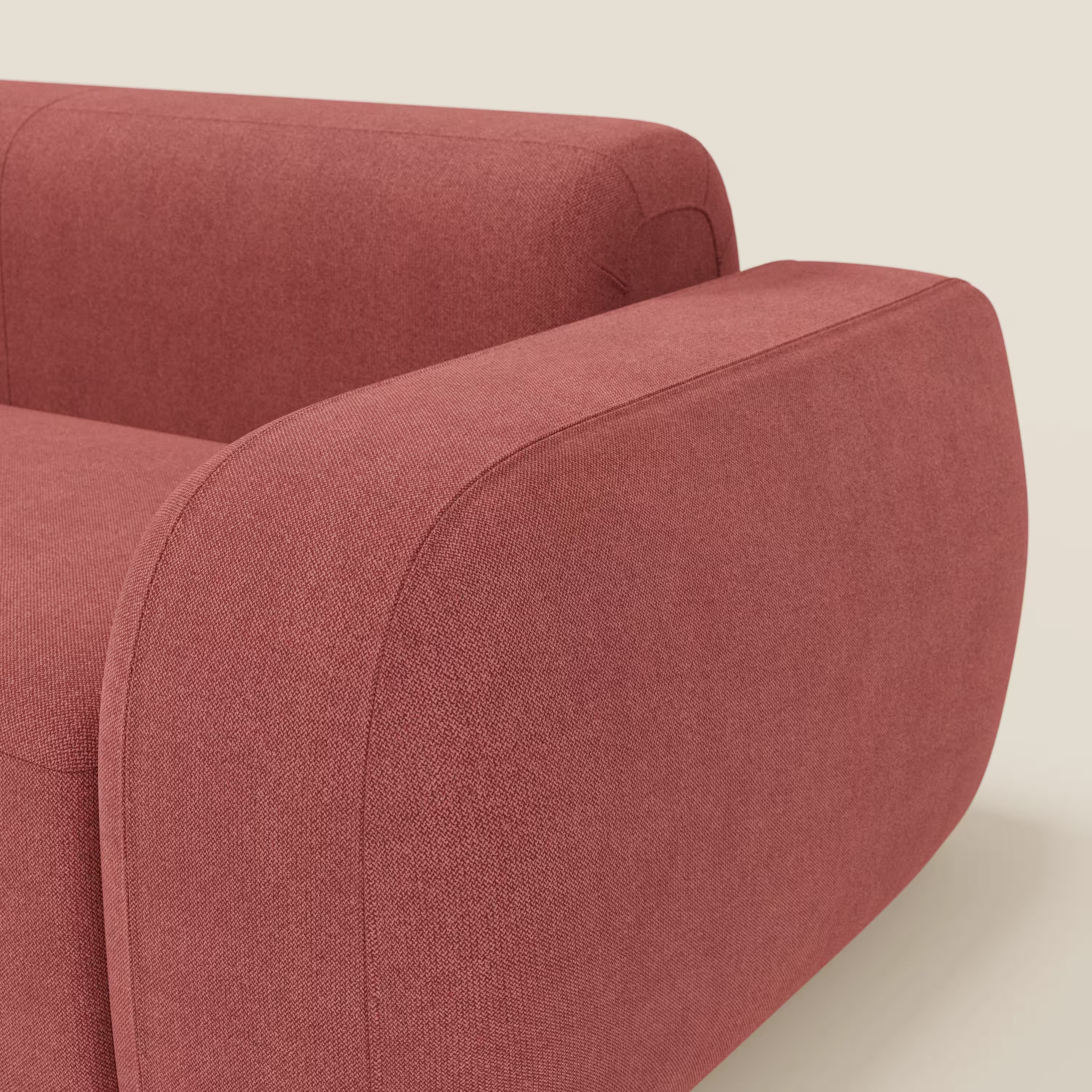 Primo piano del BonBon Divano modulare Lineare 220 di Divani.Store, caratterizzato da una seduta singola in tessuto T23 rosso ciliegia, facile da pulire, con bordi arrotondati e braccioli spessi, su uno sfondo beige chiaro che ne sottolinea lo stile minimalista.